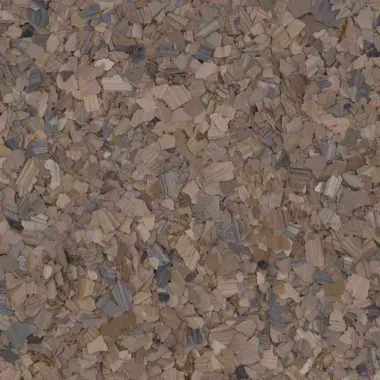 Close-up of a brown and gray flecked surface, possibly flooring or a textured material.