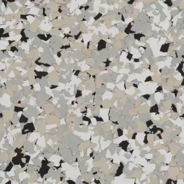Epoxy floor coating with a speckled pattern in white, beige, gray, and black.