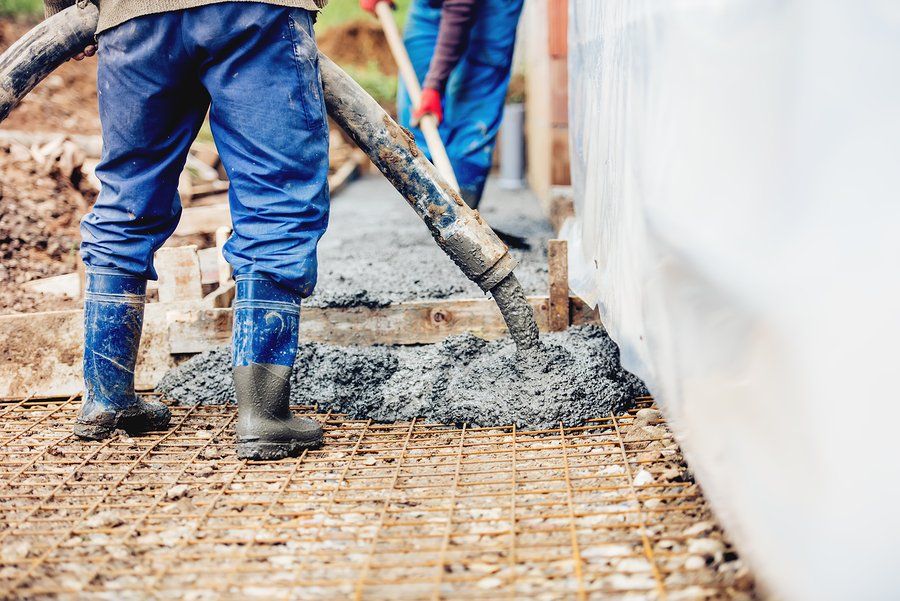 worker pouring the cement