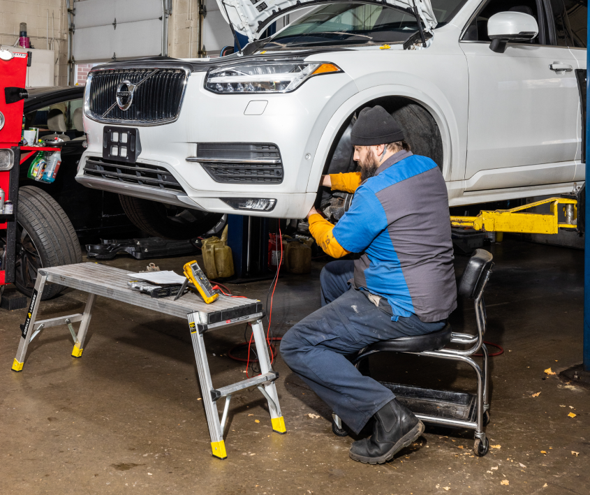 Mechanic Working on Car - Auto Evaluators