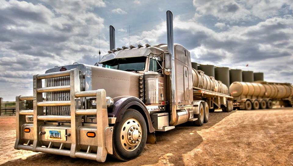 Another side view of a silver truck