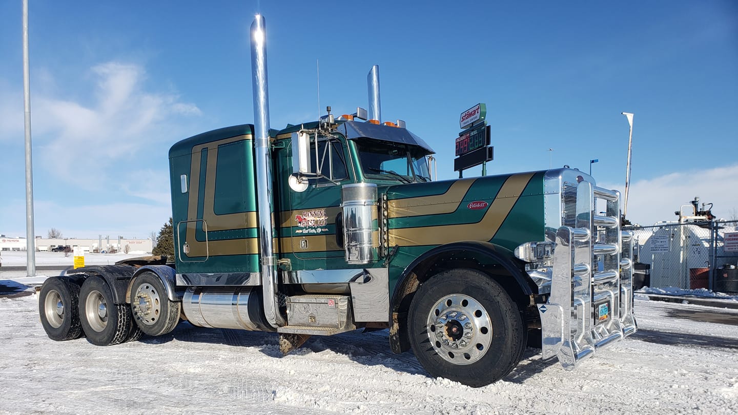 Green truck on a field