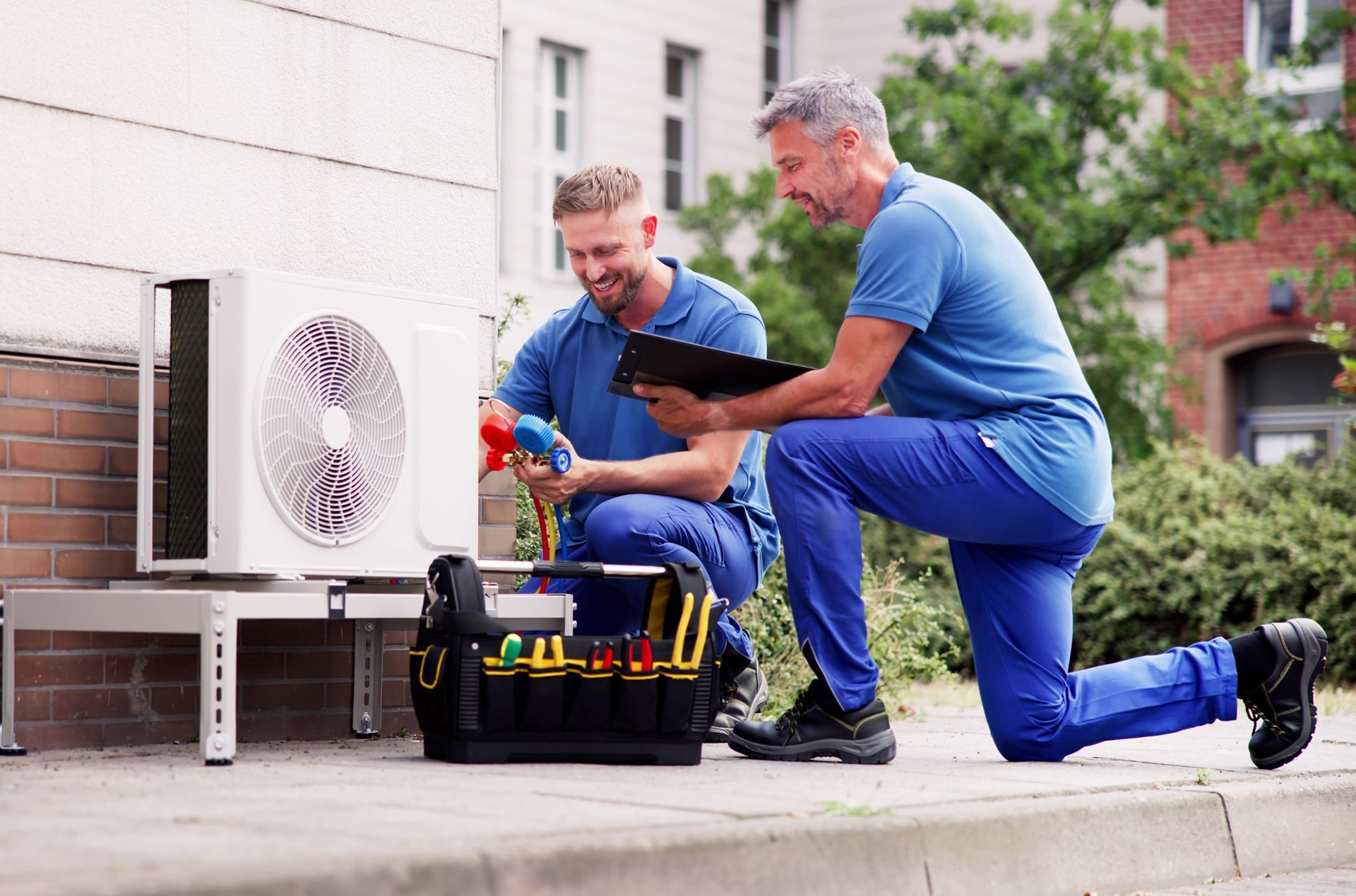 Technicians Checking the Residential HVAC Unit