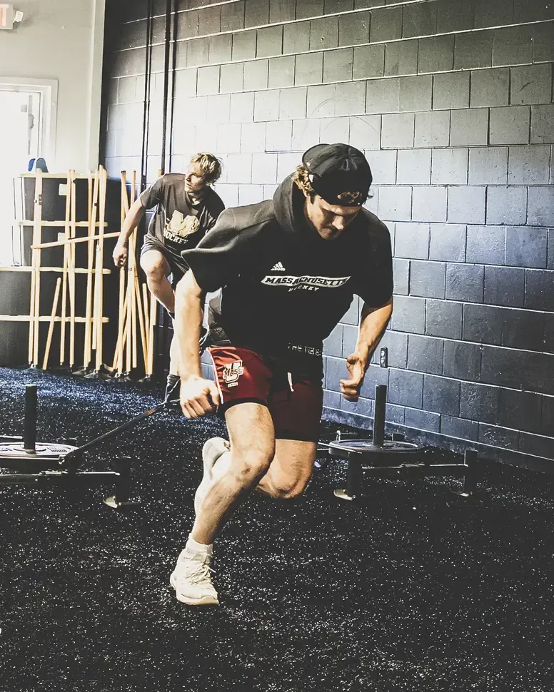 Hockey athlete sprinting on the turf at Ghost Athletica