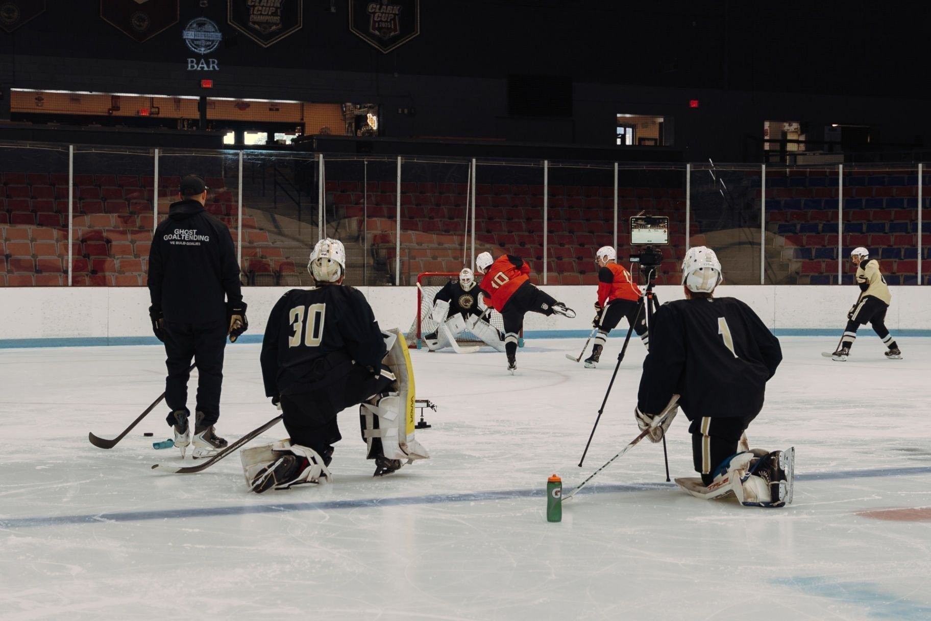 Goalie training session at Ghost Athletica: shooters, goaltenders, and tablet video review on the ice Goalie training session at Ghost Athletica: shooters, goaltenders, and tablet video review on the ice