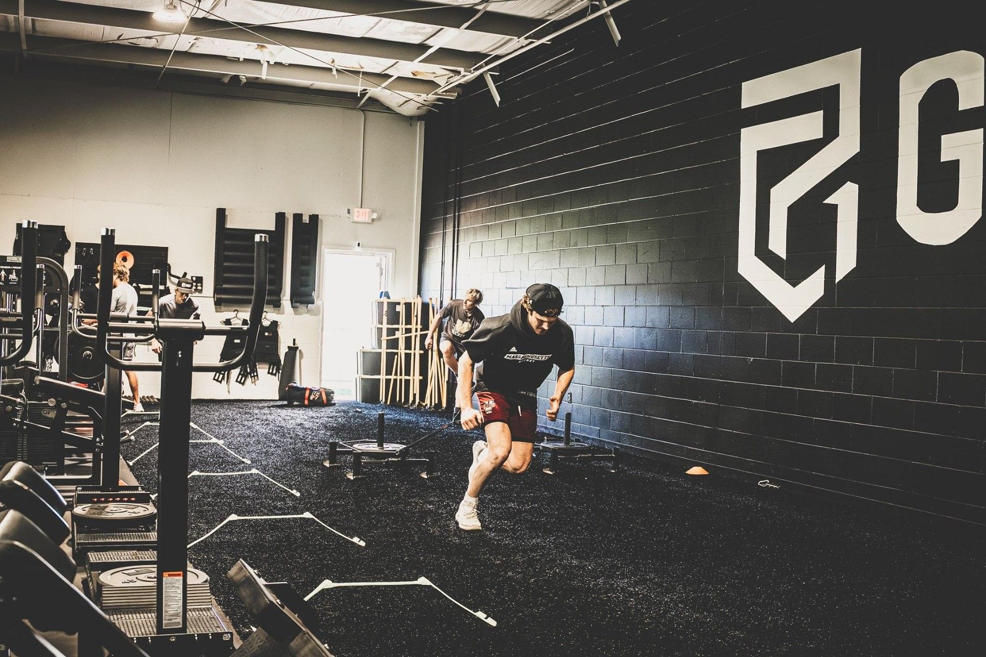 Hockey athlete sprinting during performance training at the Ghost Athletica facility