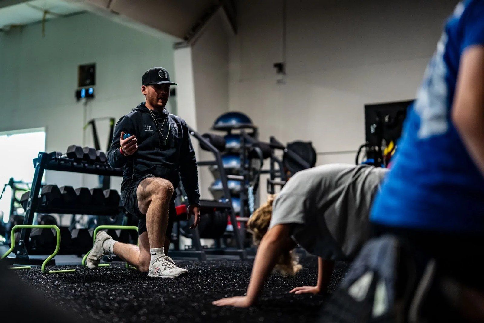 Ghost Athletica coach leading hockey athletes through a movement session
