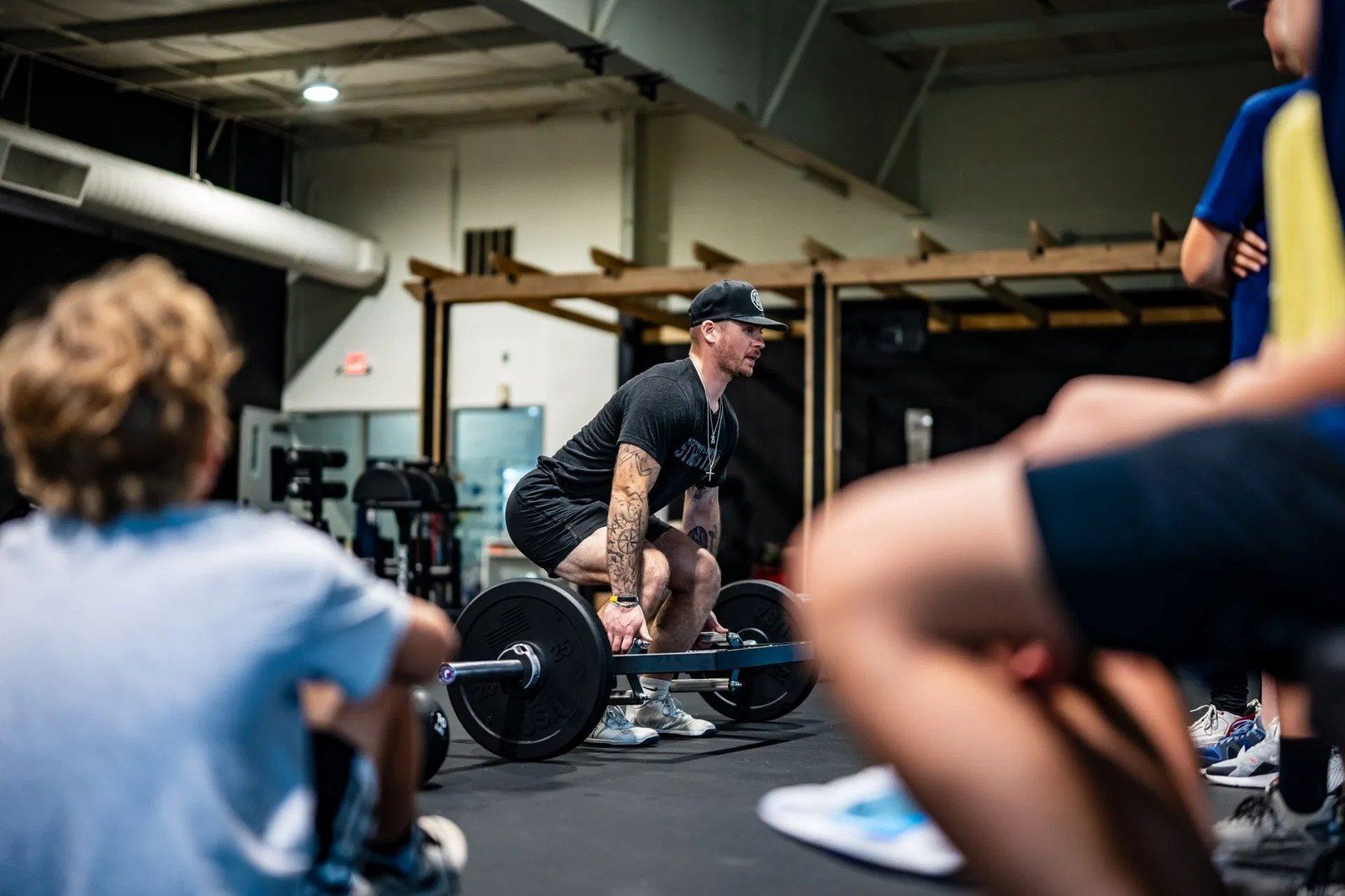 Ghost Athletica coach supervising a strength training session