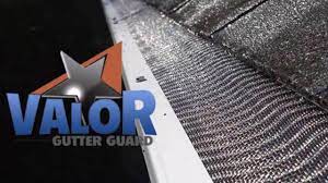 VALOR Gutter Guard logo on a metal gutter screen close-up
