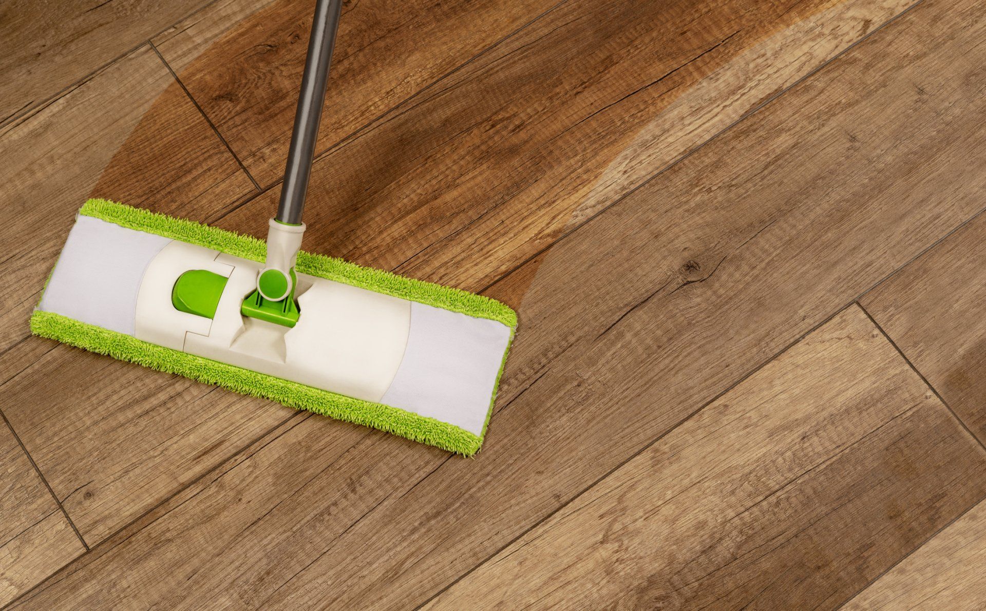 A Man Cleaning The Flooring — Coventry, CT — Chasse Hardwood Flooring A Man Cleaning The Flooring — Coventry, CT — Chasse Hardwood Flooring