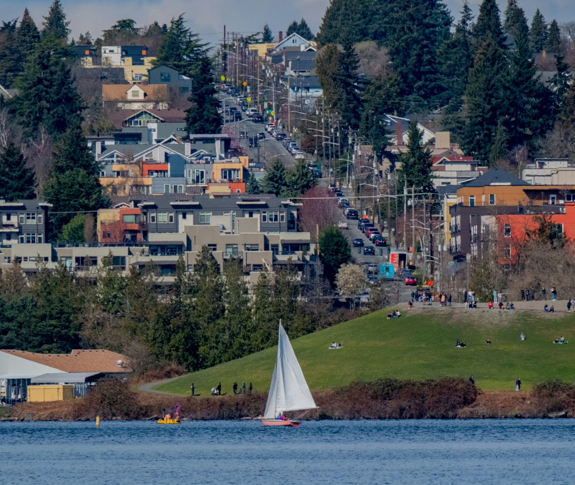 A sailboat is in the water near a city at Stack House.