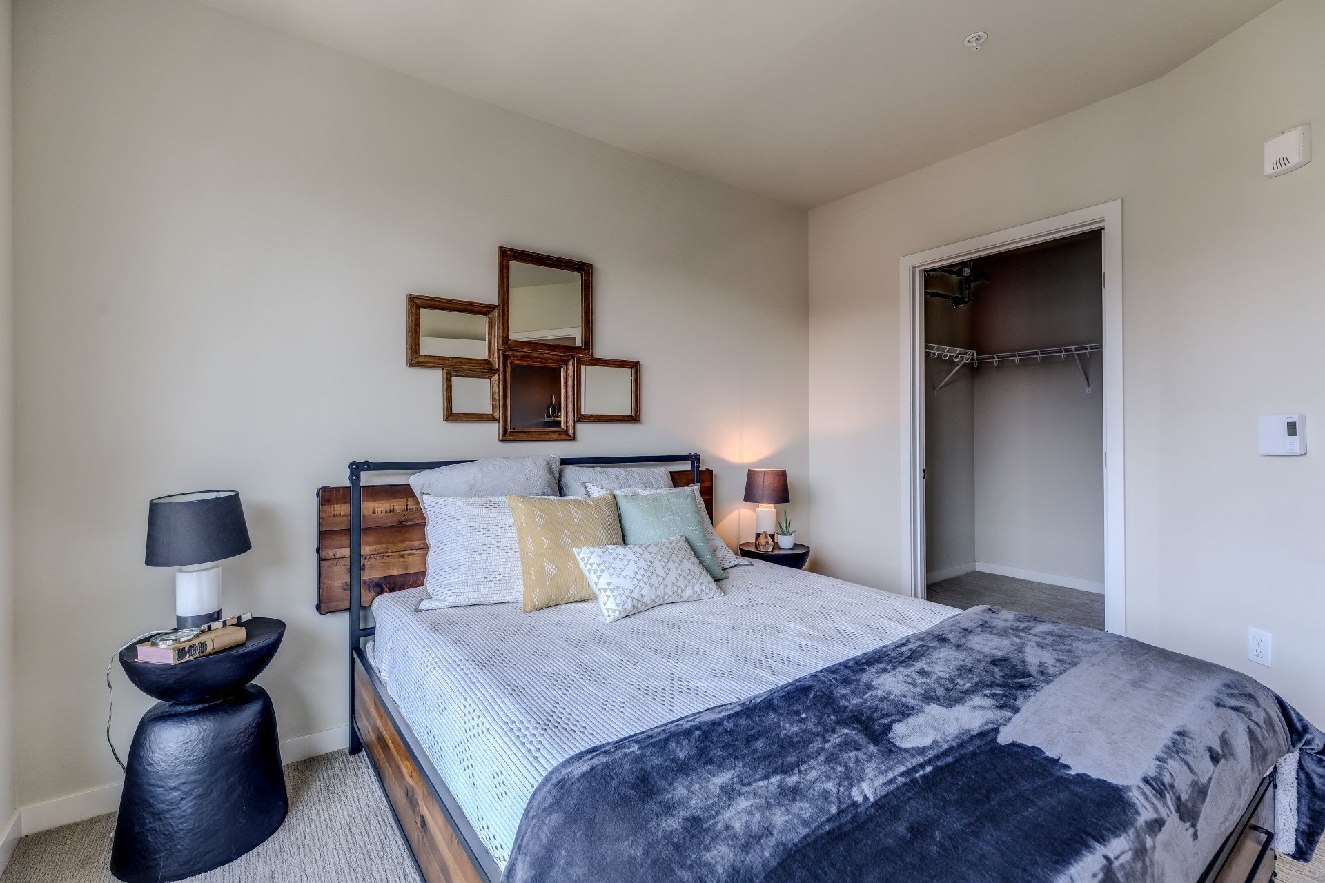 A bedroom with a large bed and a walk in closet at Stack House.