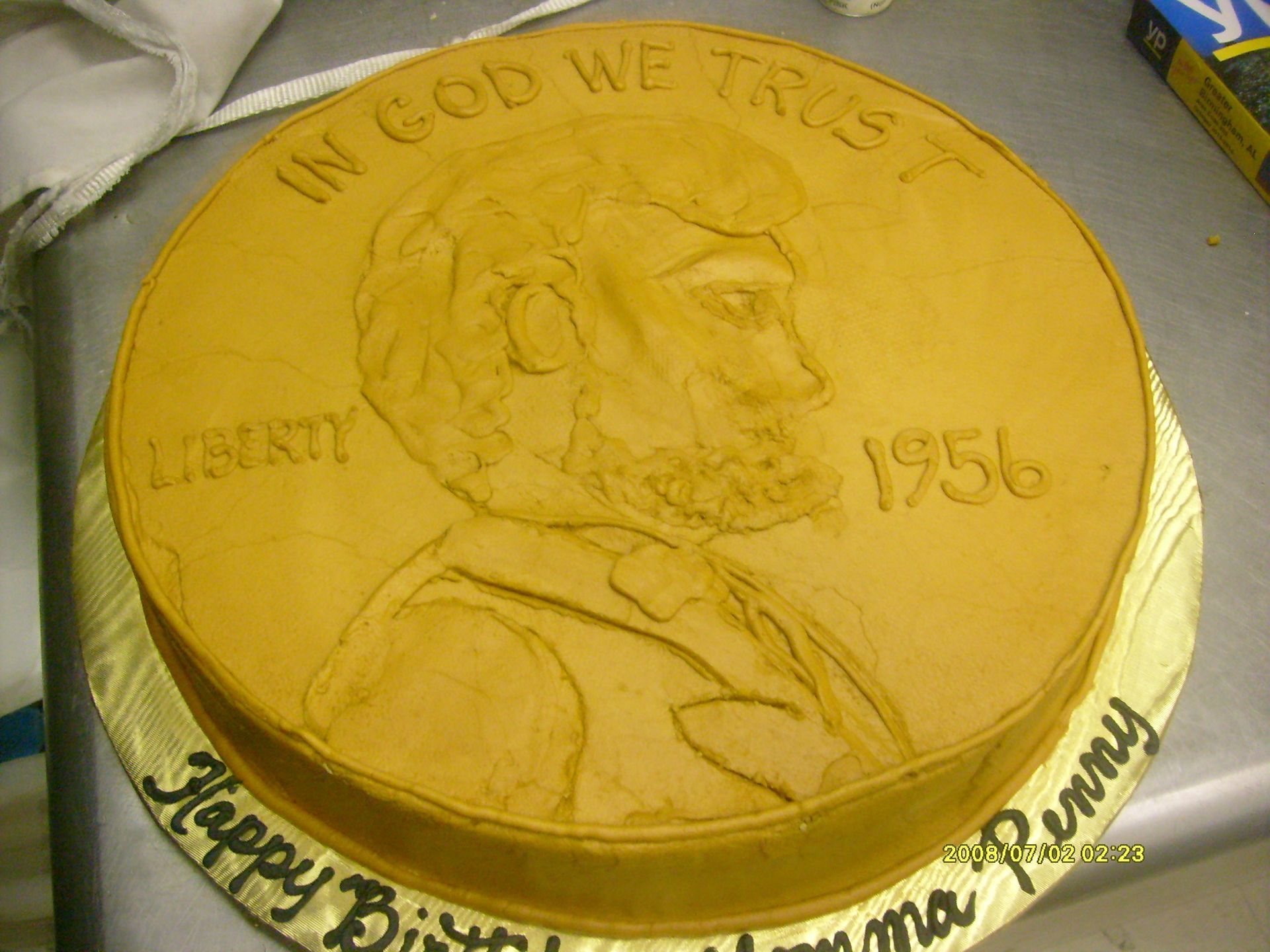 Yellow frosted cake with a JFK portrait,