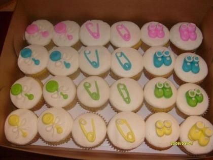 Assorted Easter eggs with colorful icing letters arranged in rows in a box