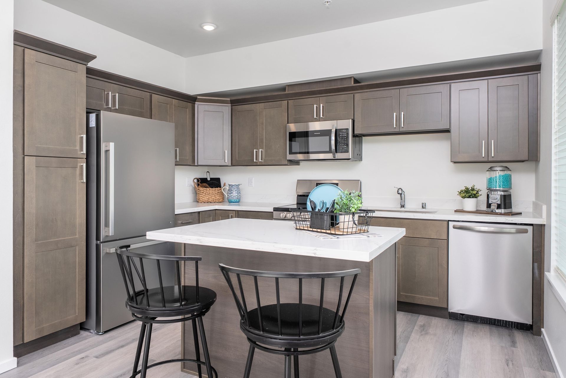Modern kitchen with stainless steel appliances at Blueberry Apartments rentals in Port Orchard