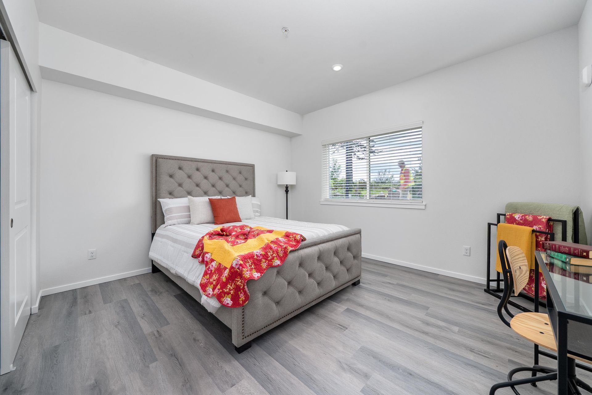 Bedroom with bed and vinyl plank flooring at Blueberry Apartments rentals, Port Orchard