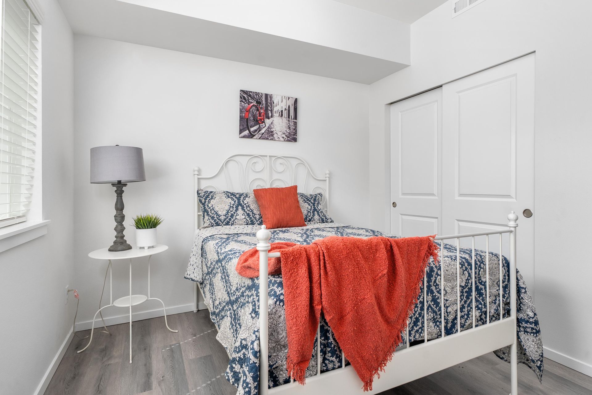 Bedroom with bed and large window at Blueberry Apartments rentals in Port Orchard