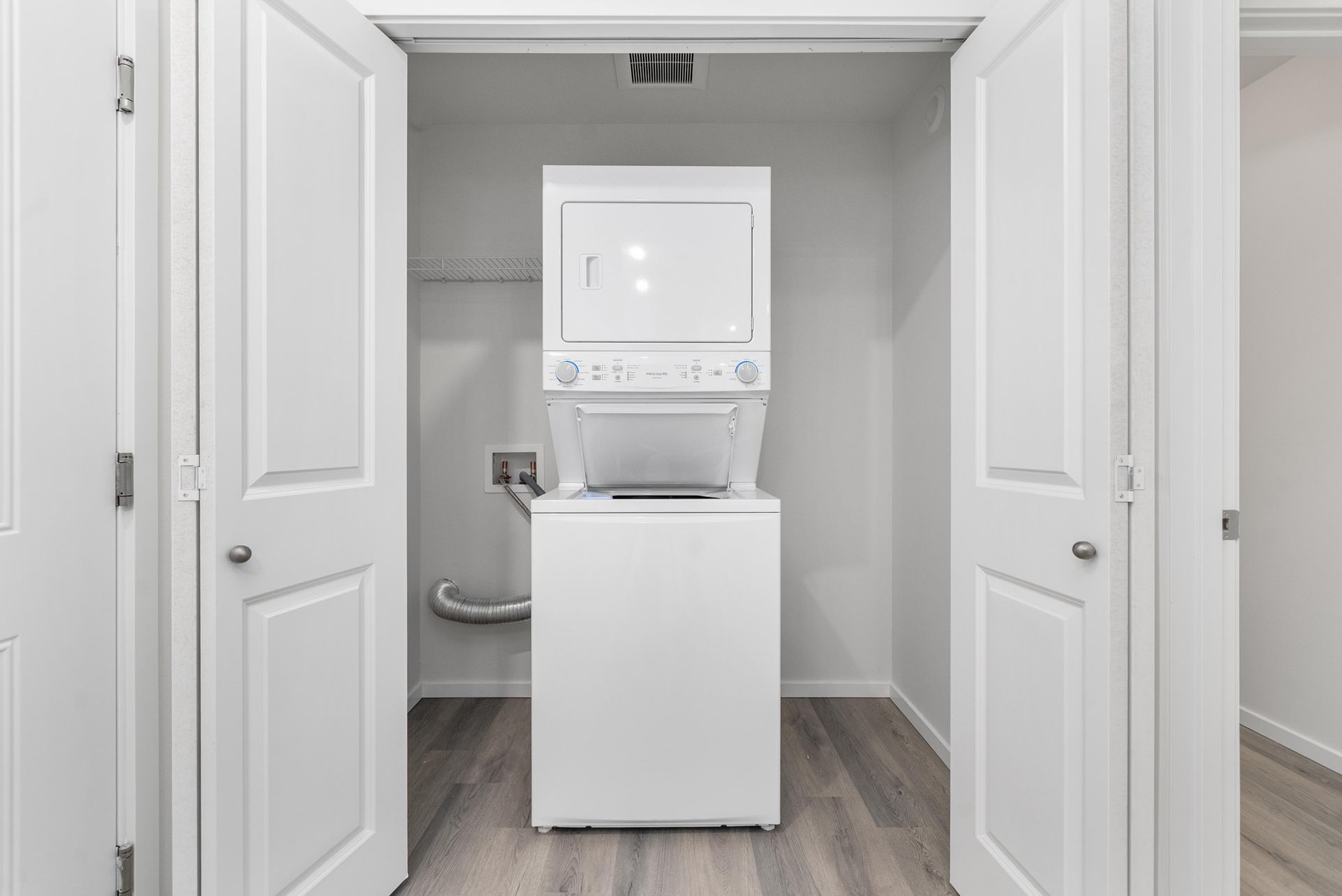Modern open-concept living and dining area with luxury flooring at Blueberry Apartments, Port Orchard.