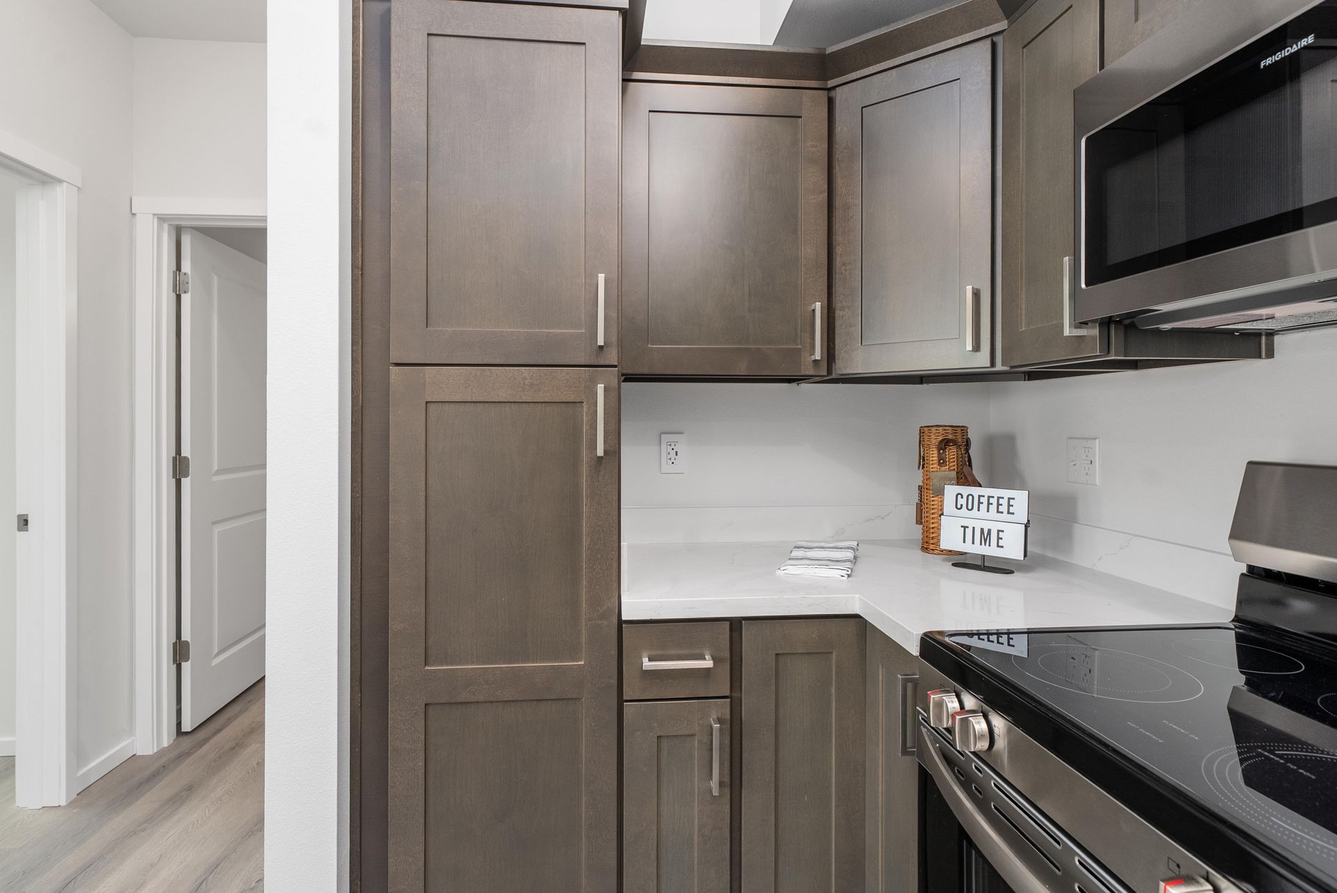 Kitchen detail showing dark cabinetry and countertops at Blueberry Apartments in Port Orchard