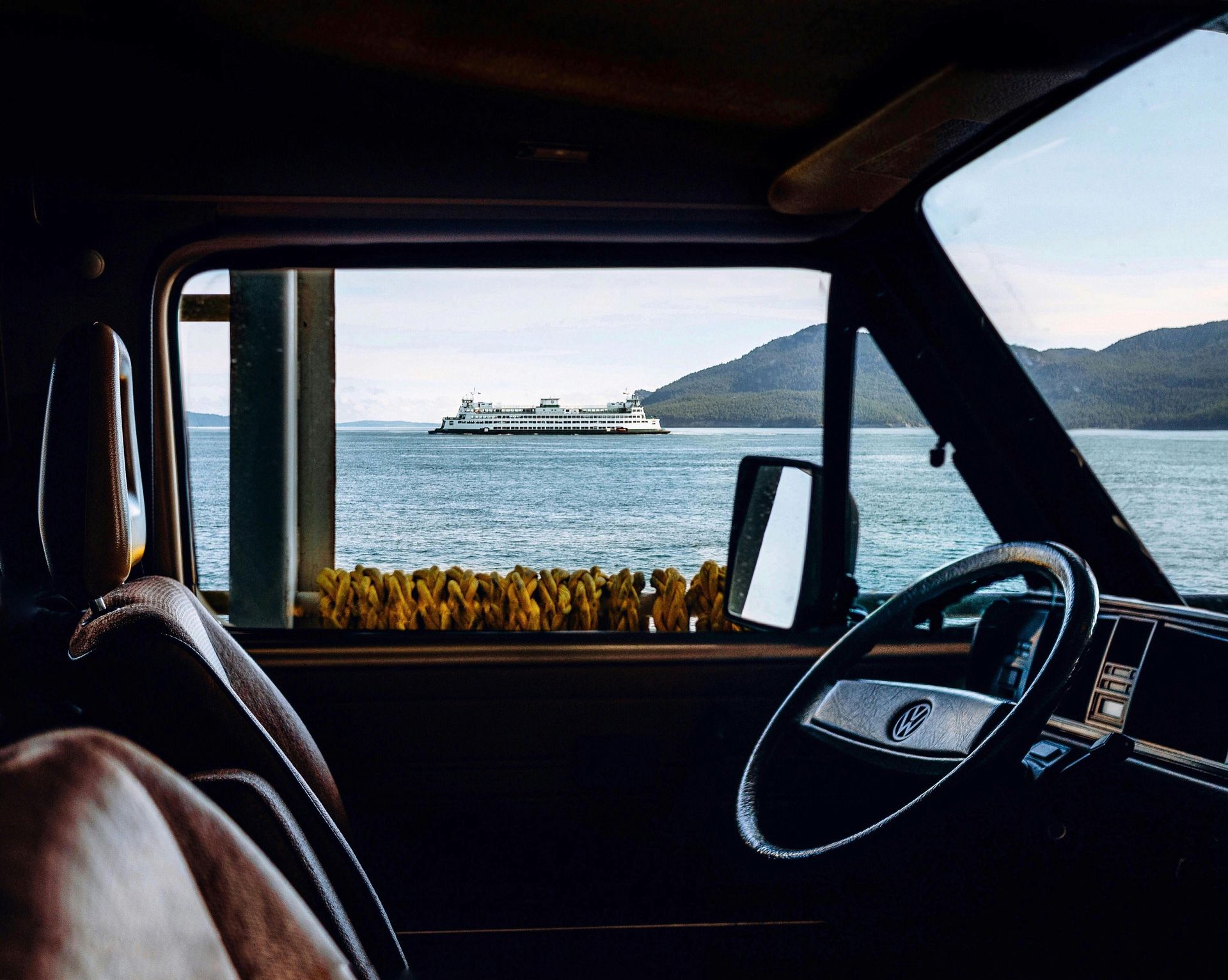 A view of the ocean from the inside of a car