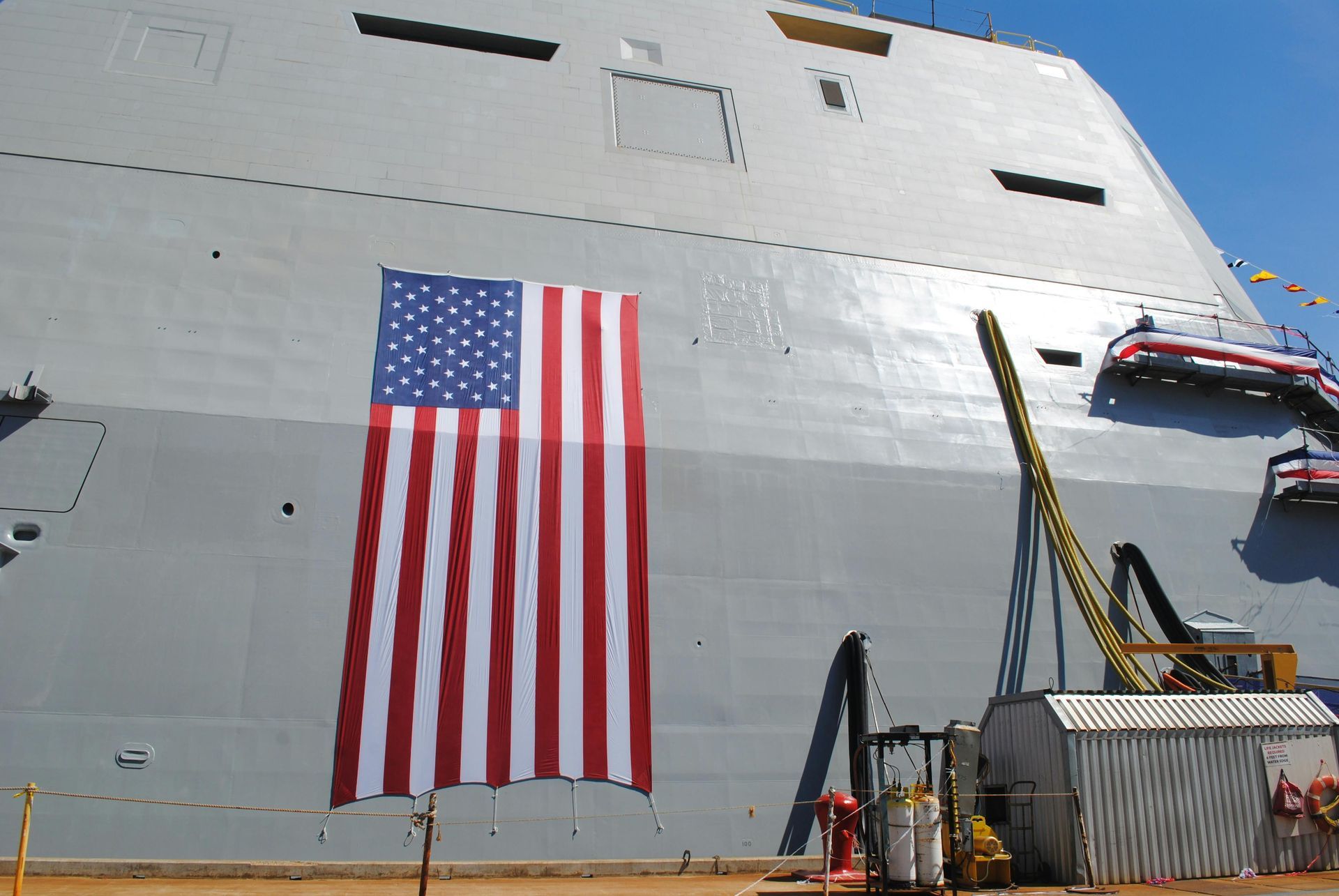An american flag is painted on the side of a large ship