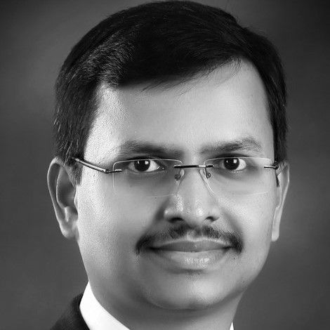 Black and white headshot ofJP Puttaswamy
