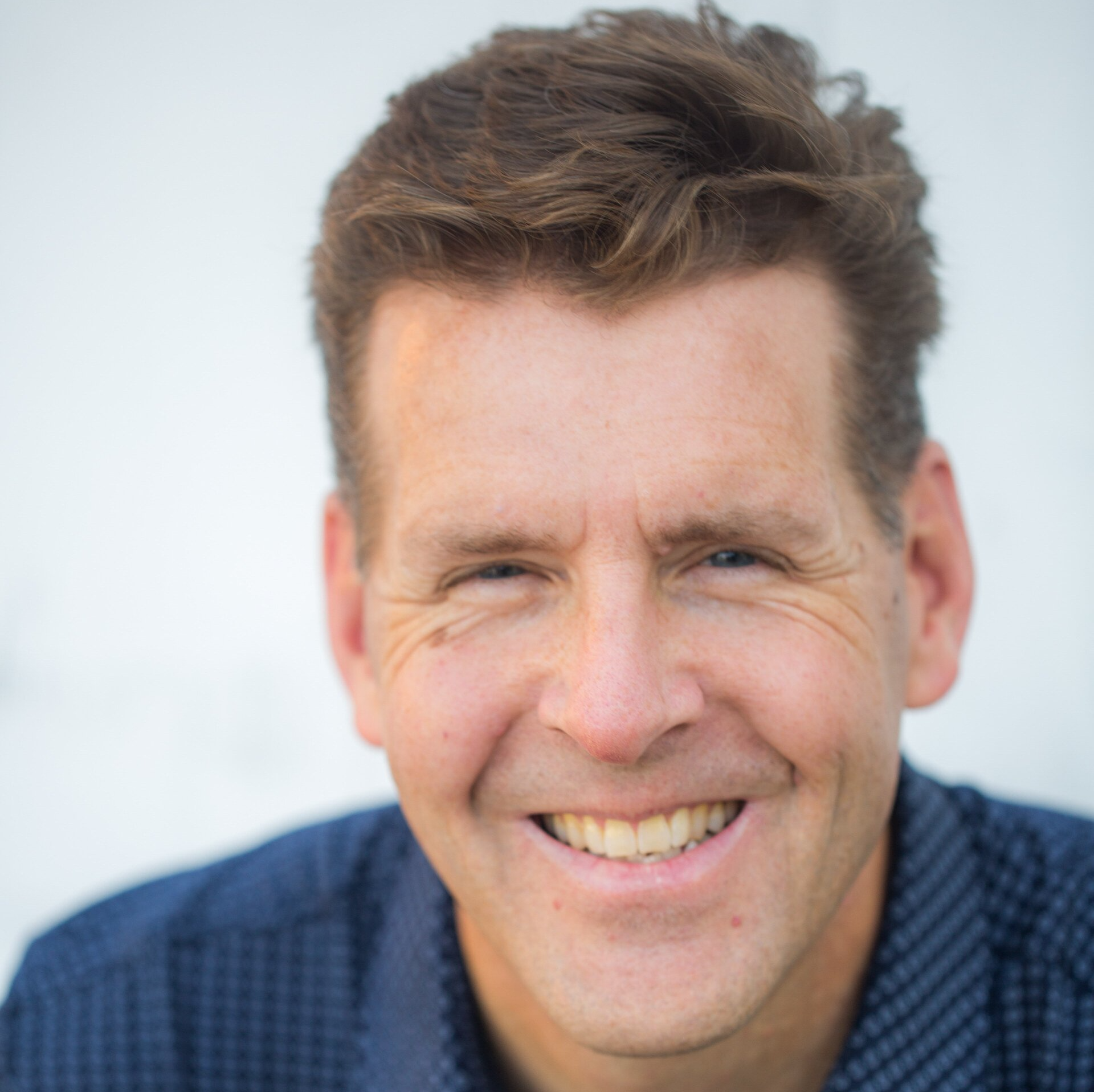 A close up of Pete Behrens, a white man with brown hair.