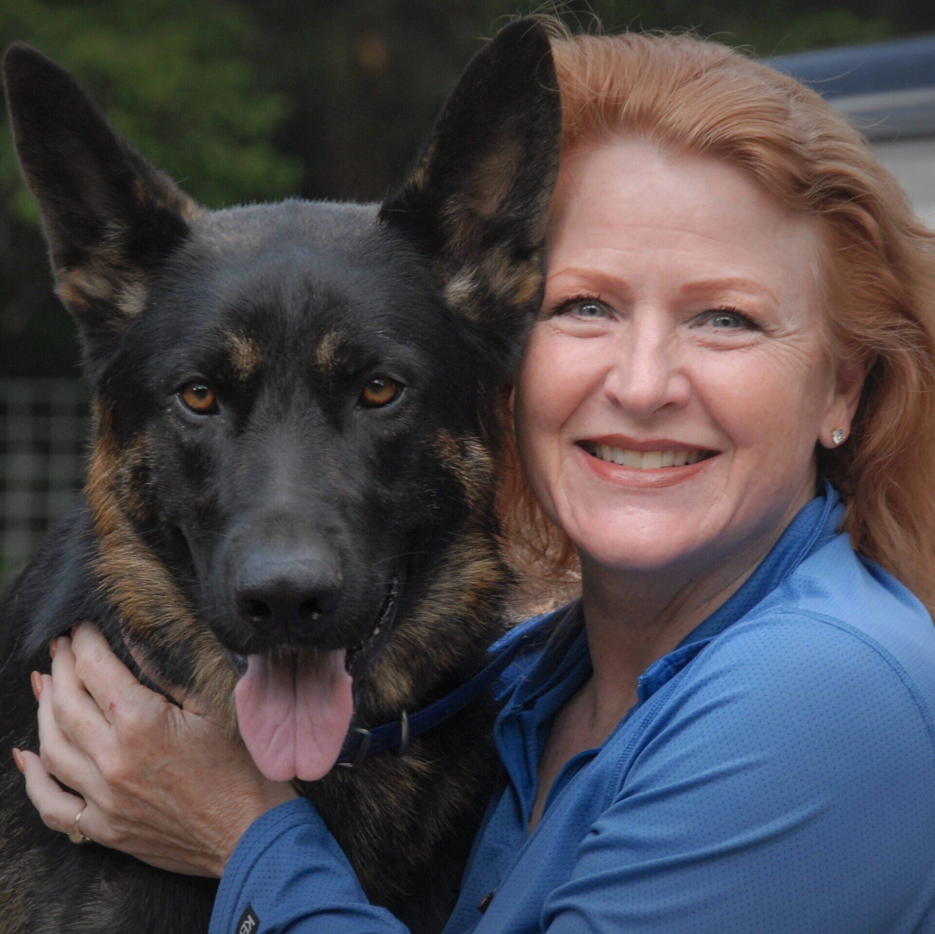 Color headshot of Shawna Schuh with a german shepard
