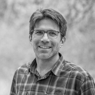 A black and white headshot of Josh Forman