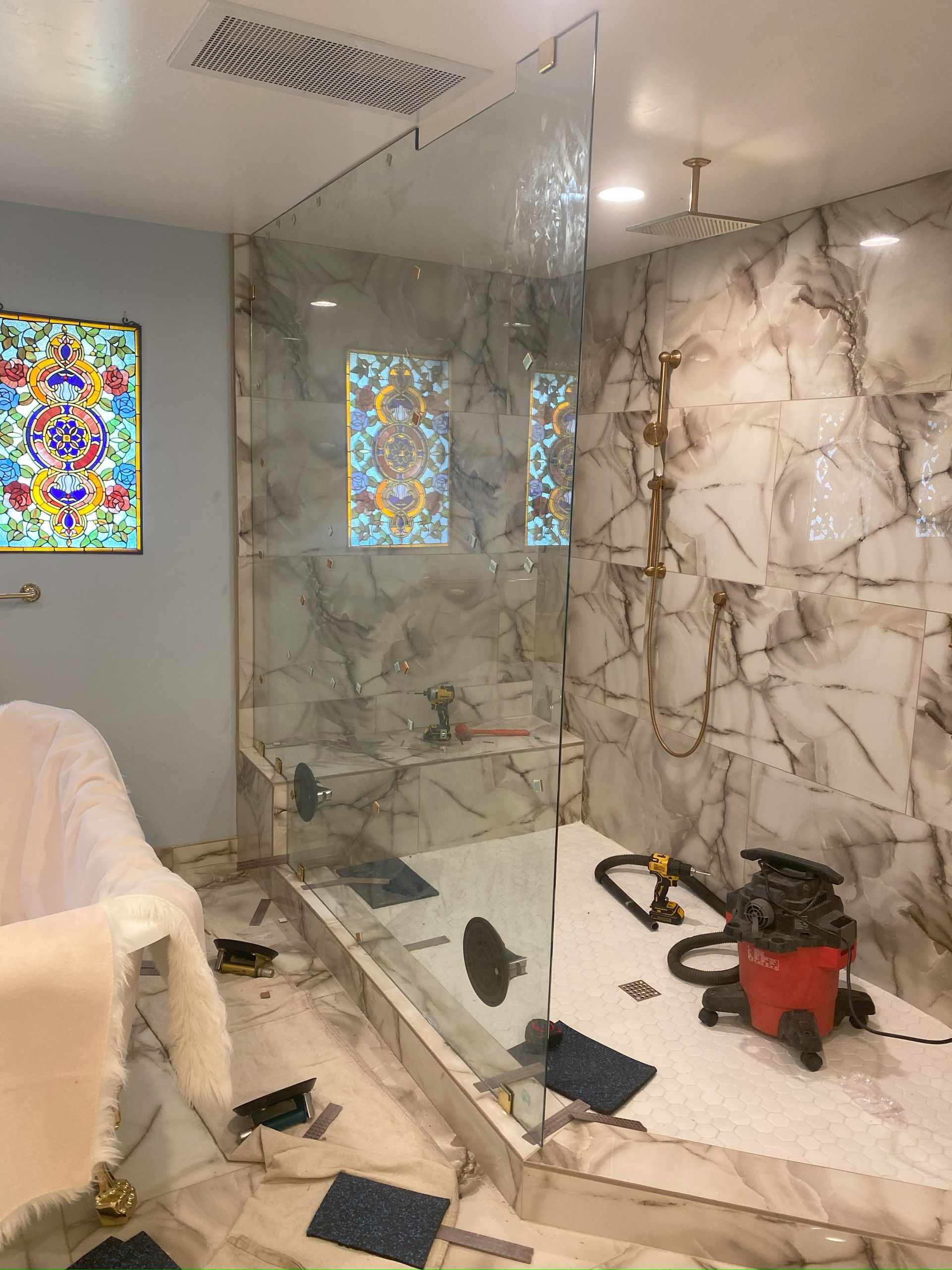 High-end bathroom remodel featuring frameless shower glass
