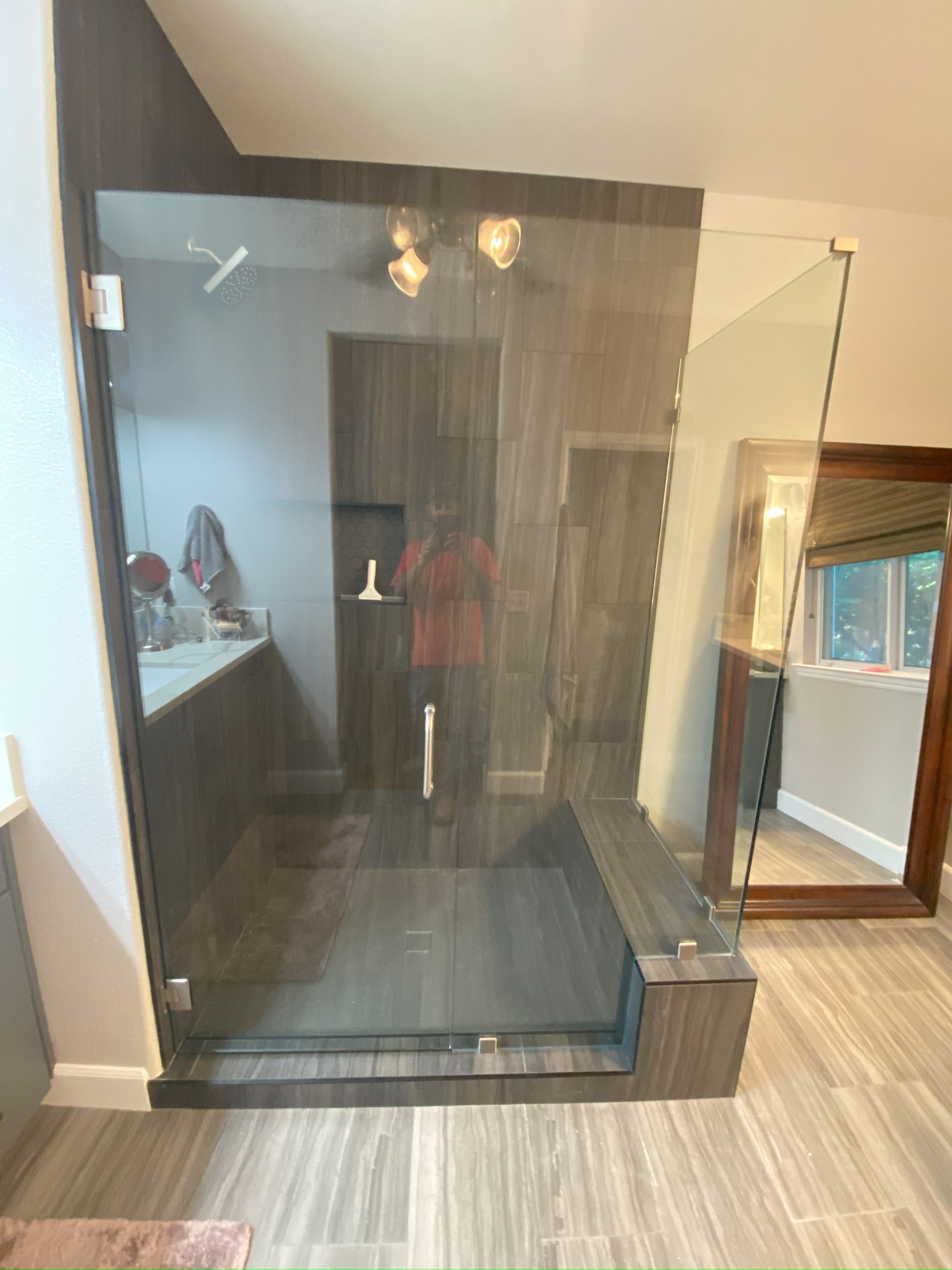 Contemporary shower design with custom glass panels