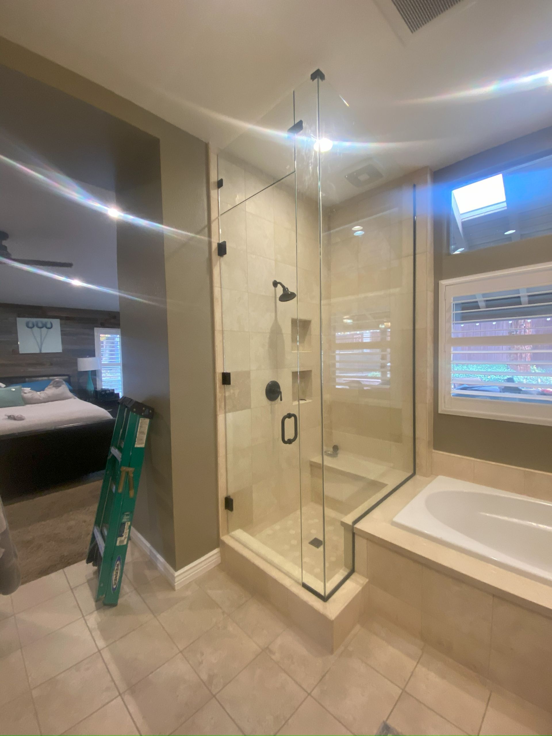 Frameless glass shower enclosure installed in San Antonio bathroom
