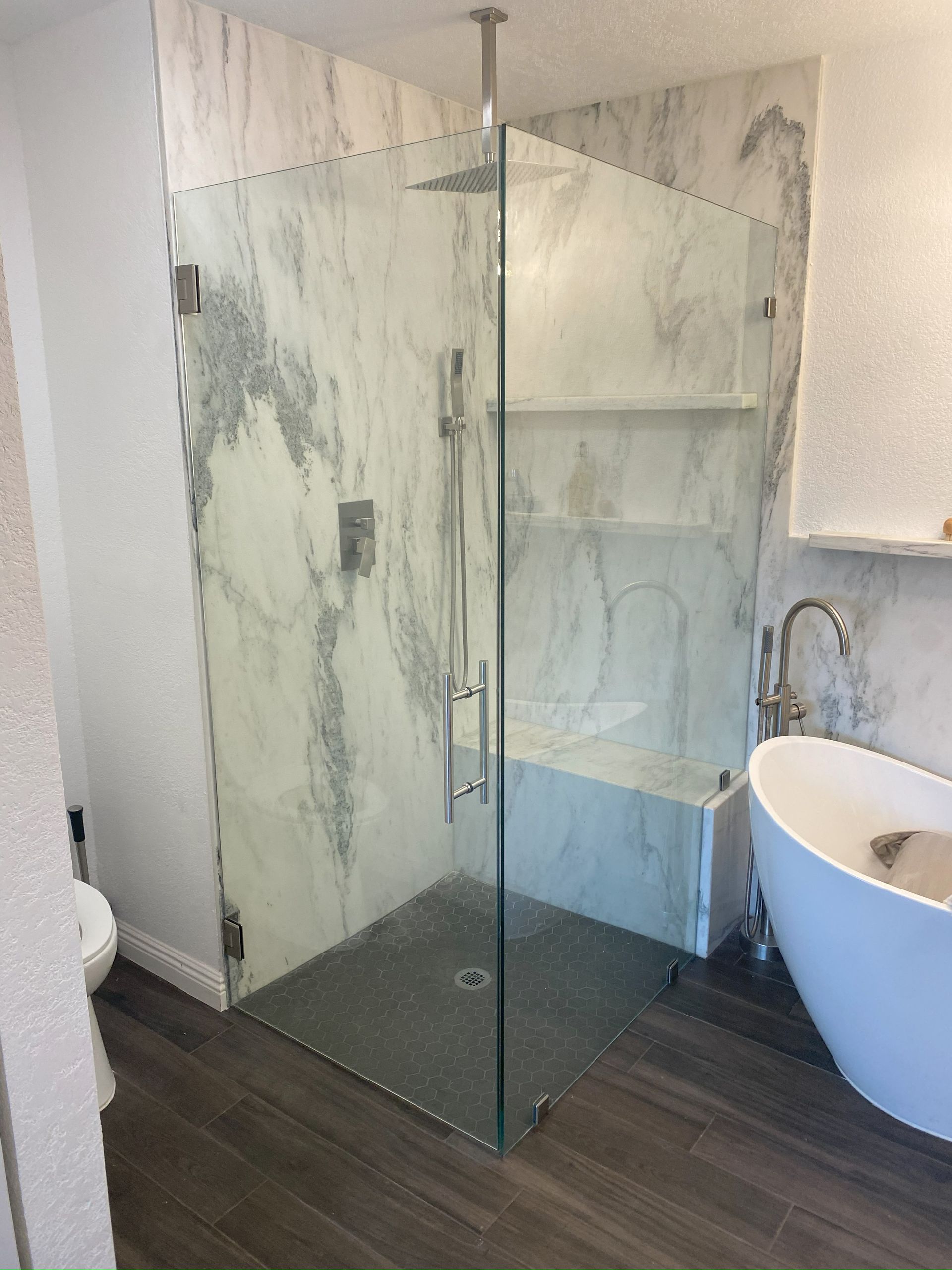 Contemporary shower design with custom glass panels