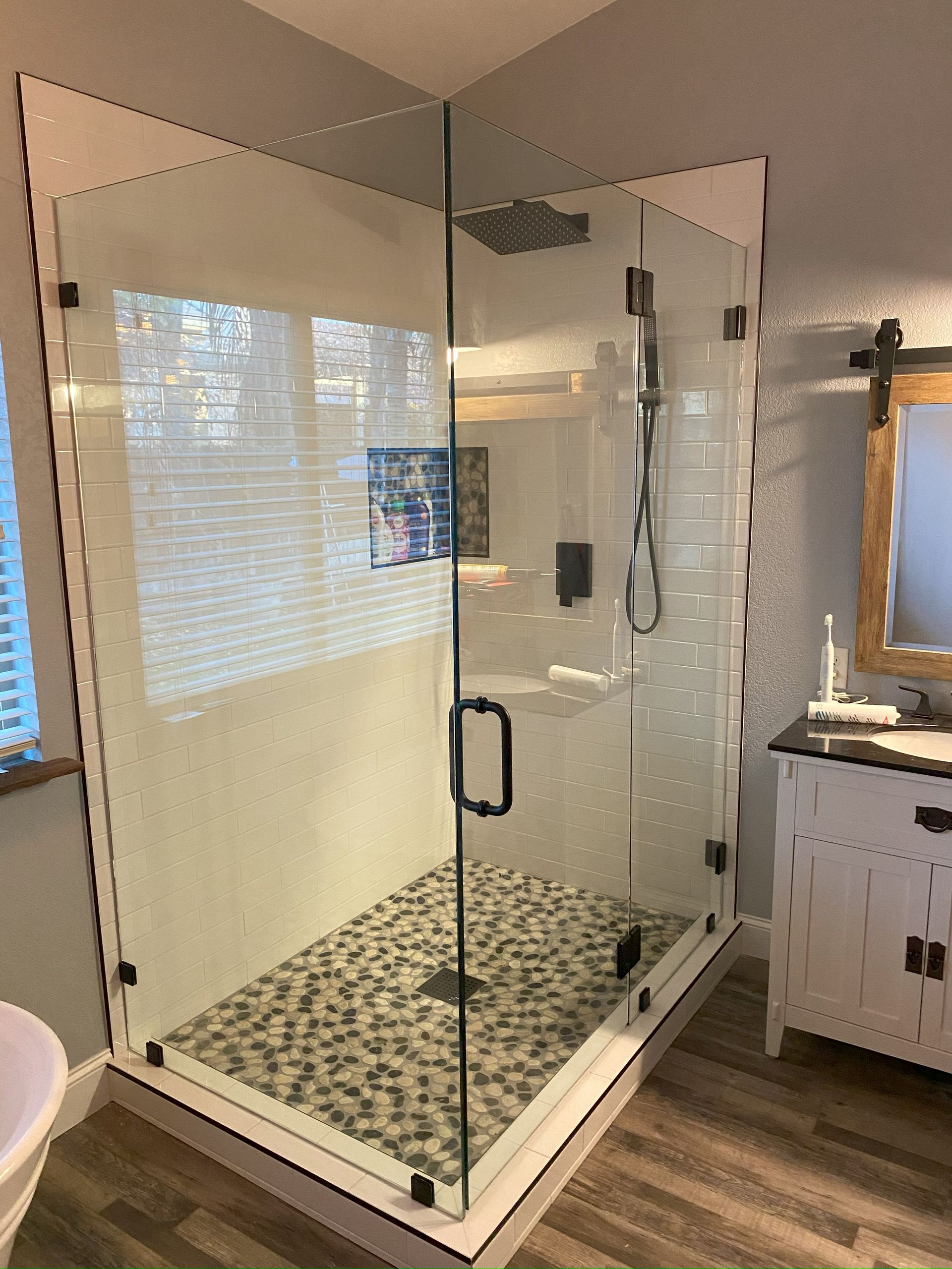 Contemporary shower design with custom glass panels