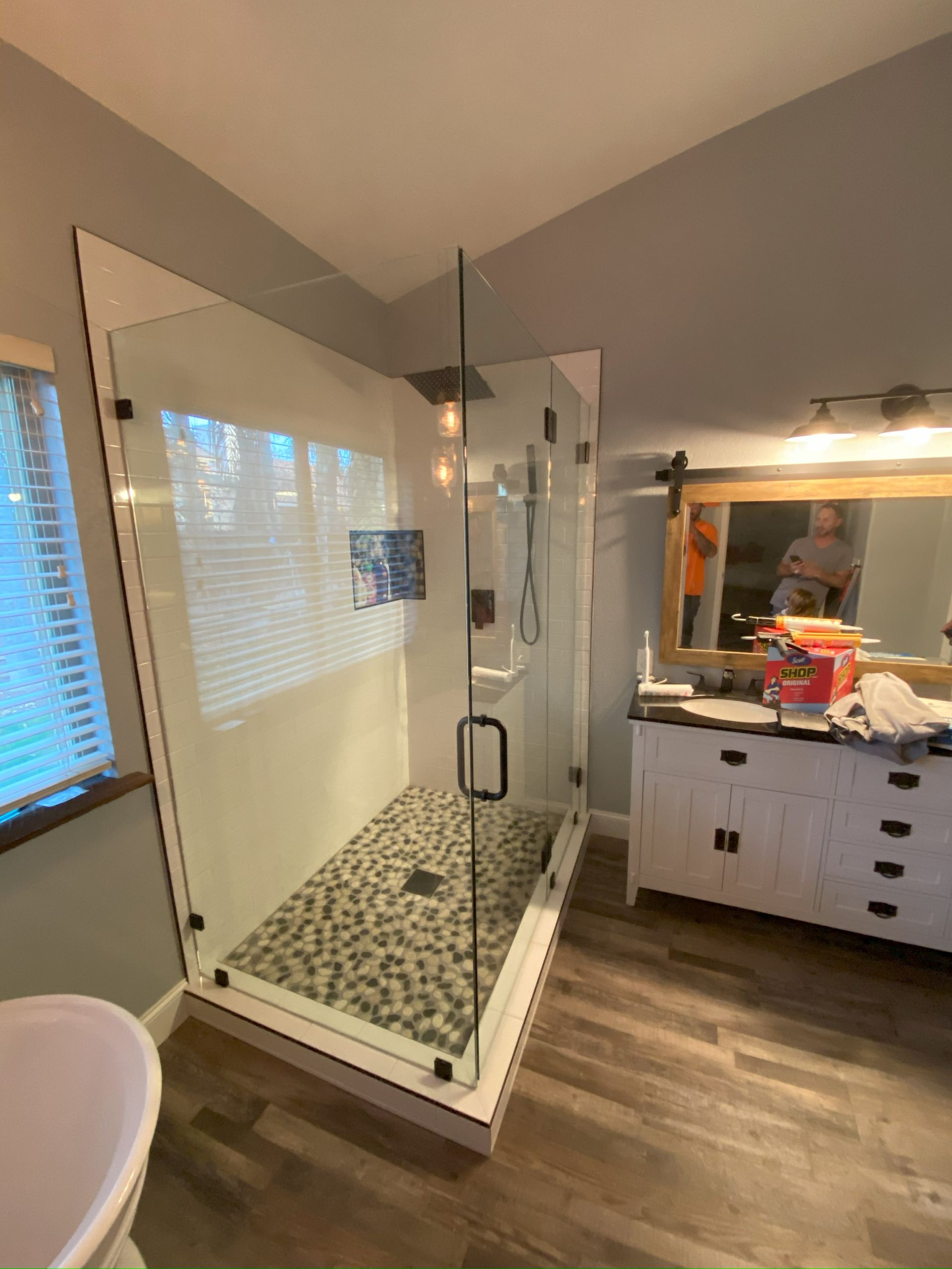Frameless glass shower enclosure by Glassology featuring ultra-clear tempered glass and polished edges