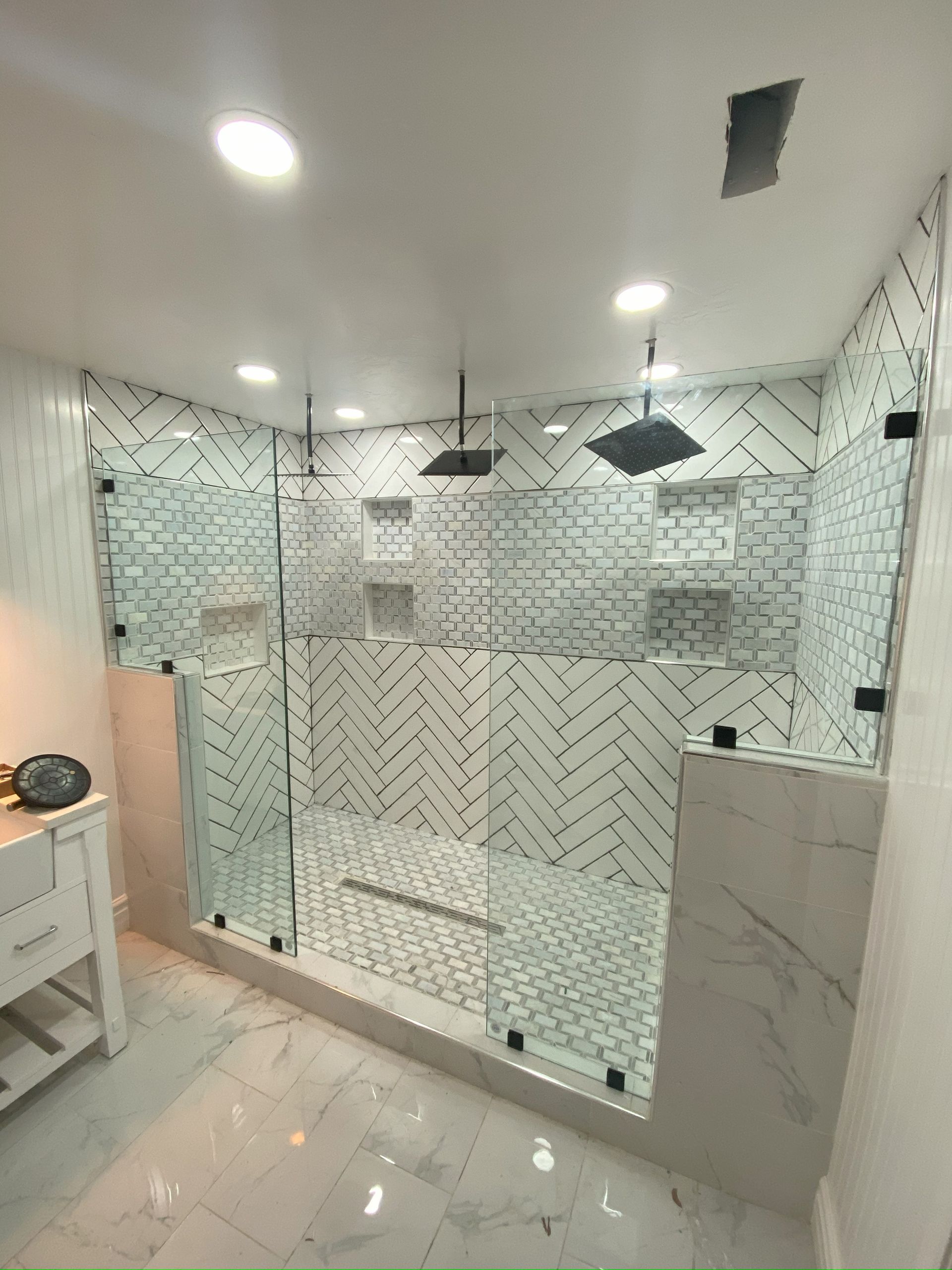 Premium frameless glass enclosure by Glassology with clean seams and minimal fittings