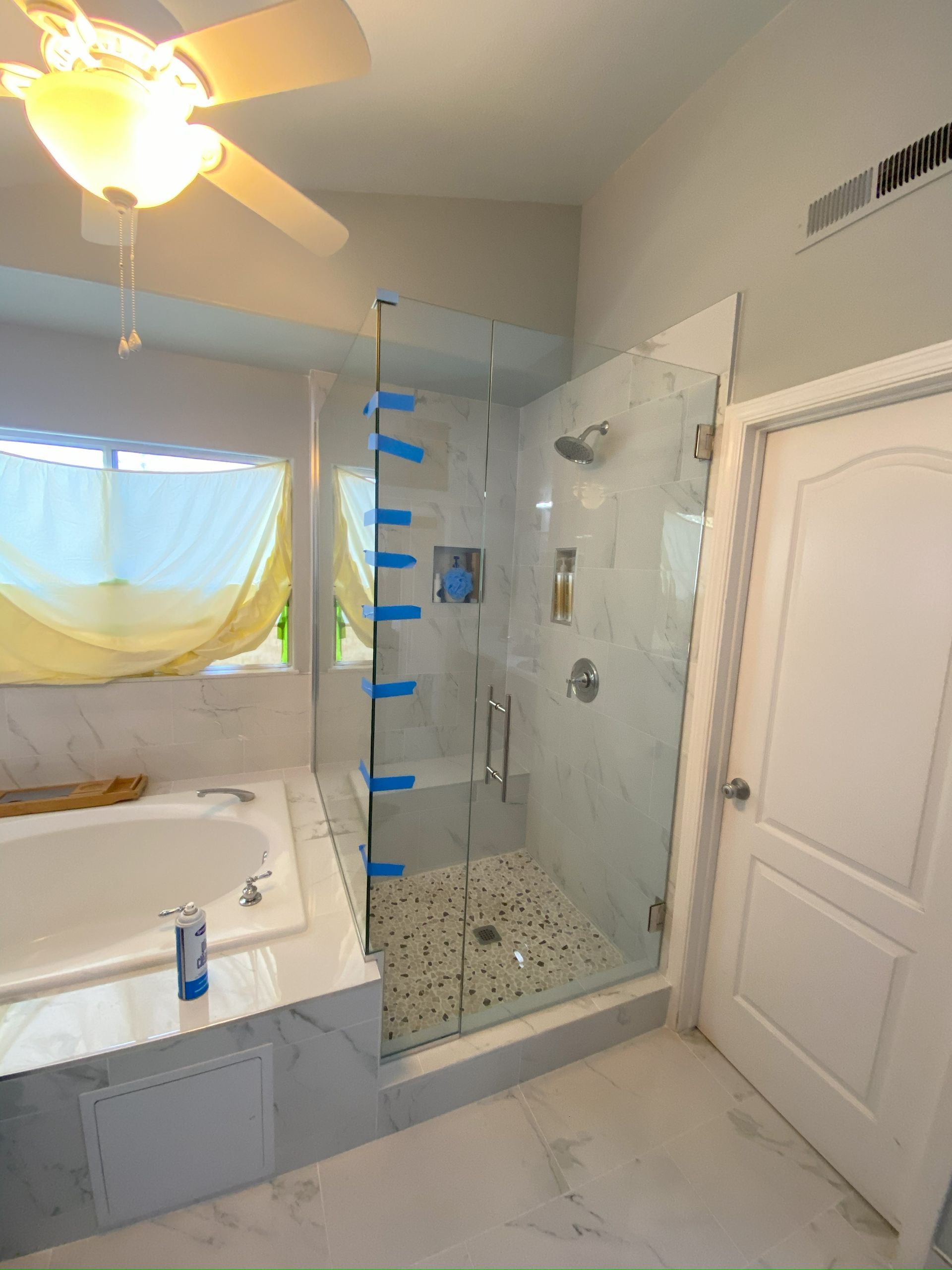 Frameless glass shower enclosure installed in San Antonio bathroom