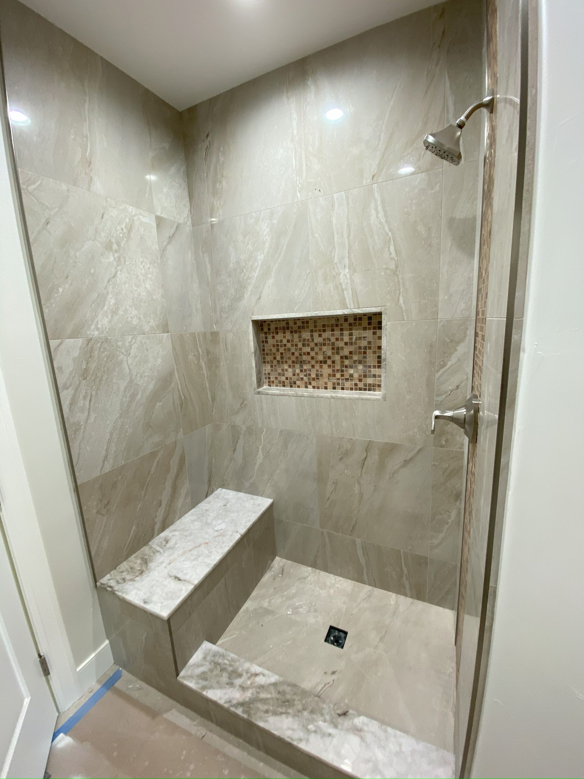 High-end bathroom remodel featuring frameless shower glass