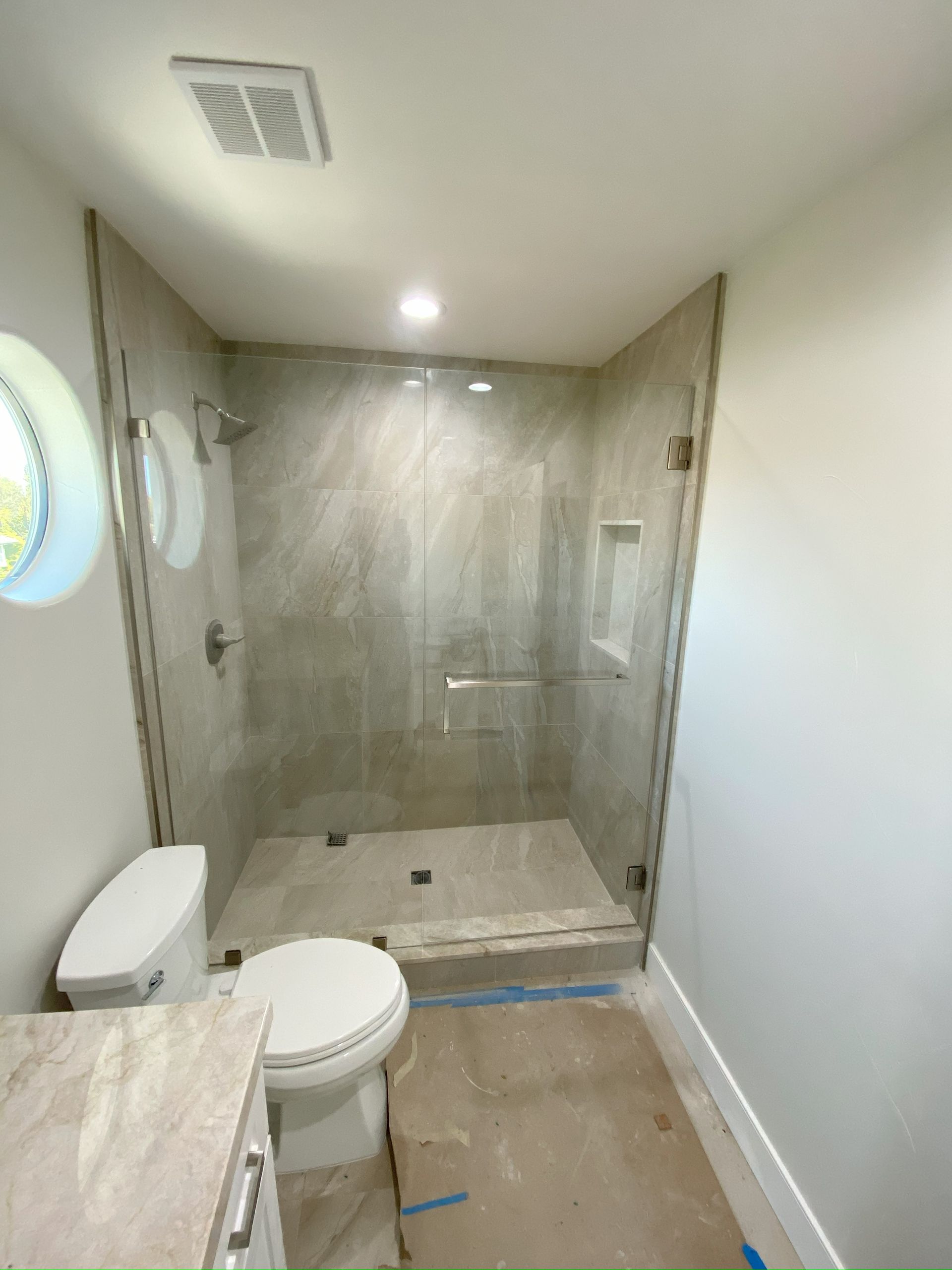 Clear tempered glass shower enclosure professionally installed