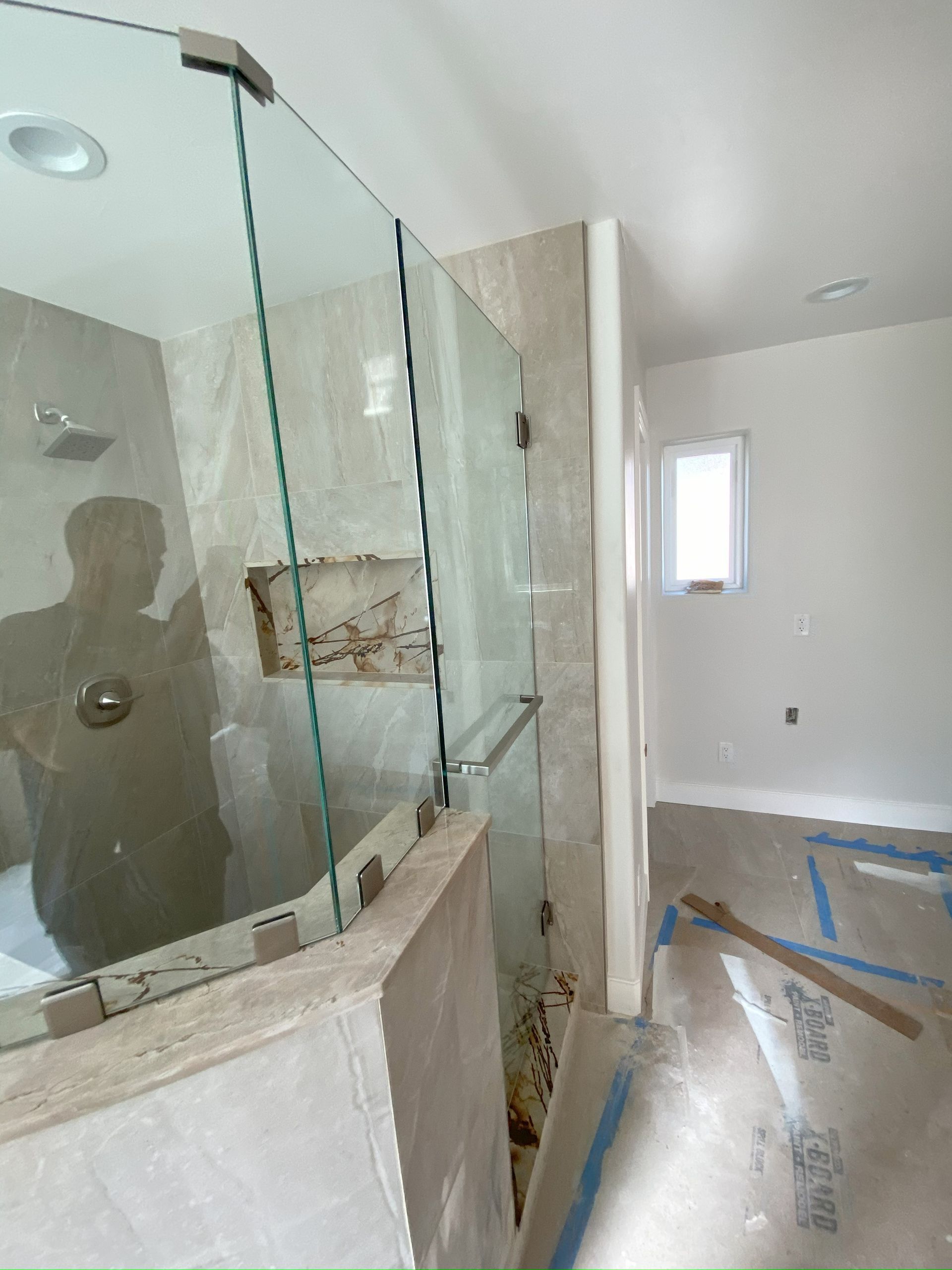 Walk-in shower with custom glass enclosure