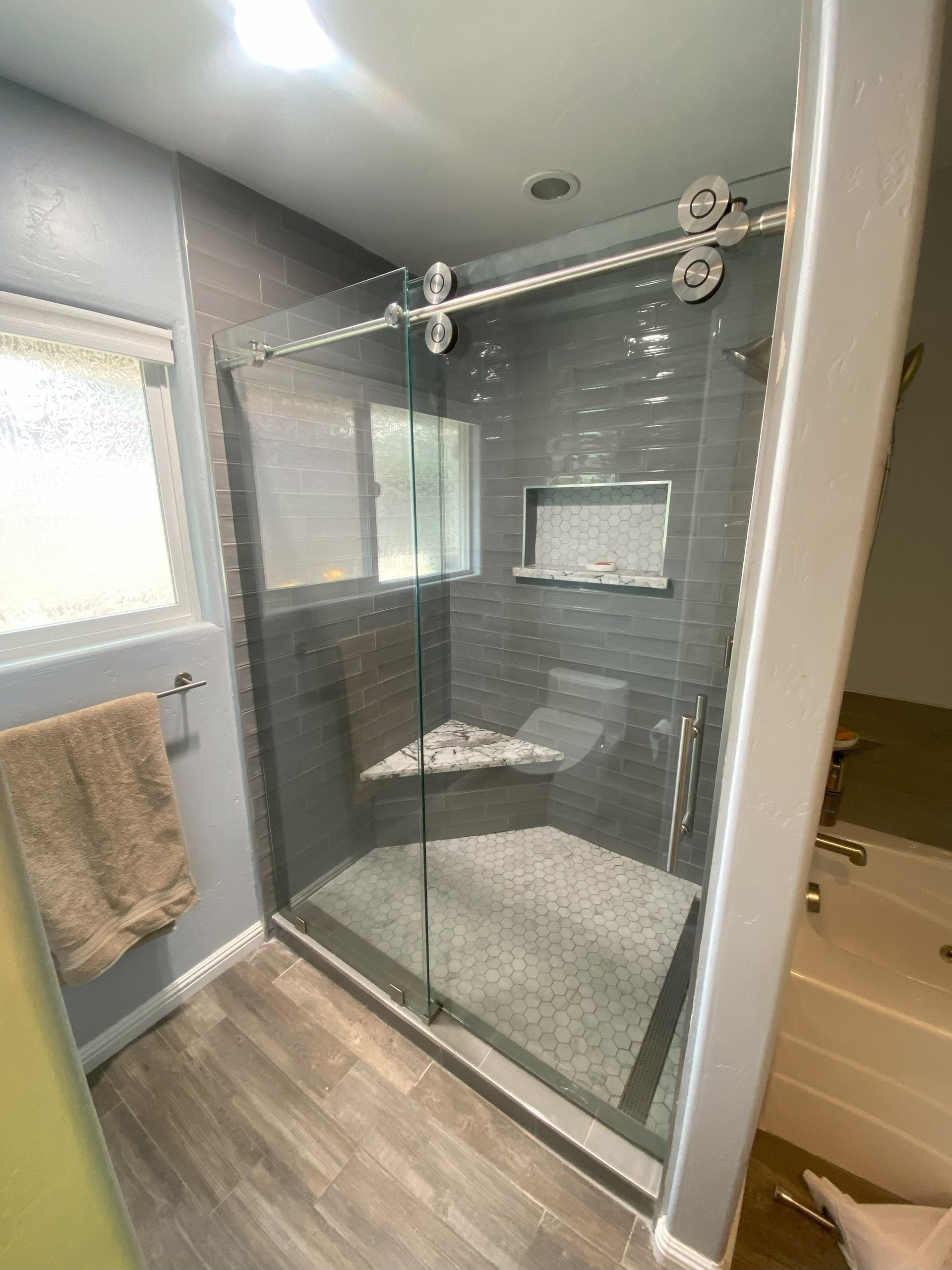 Contemporary shower design with custom glass panels