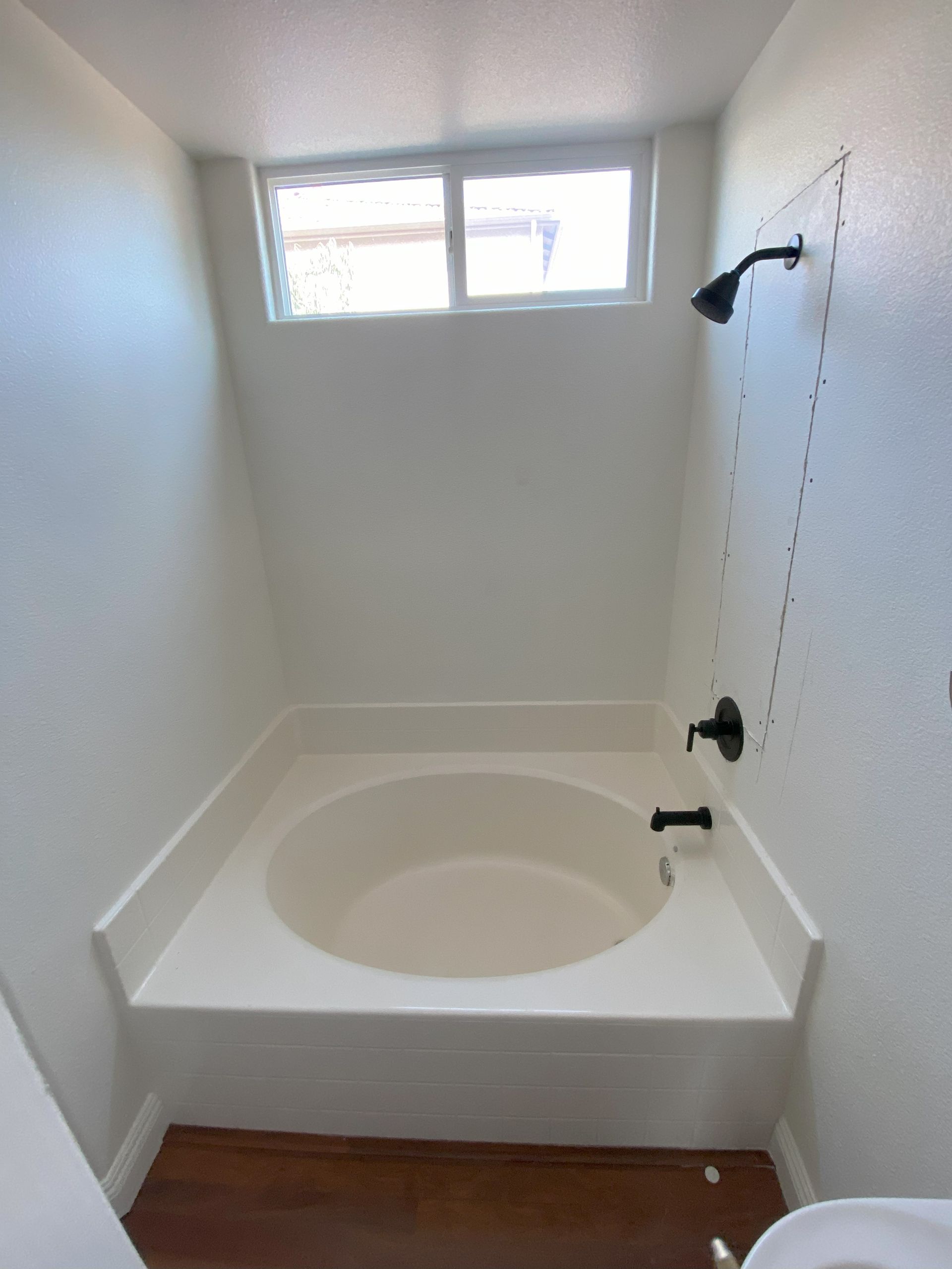 High-end bathroom remodel featuring frameless shower glass