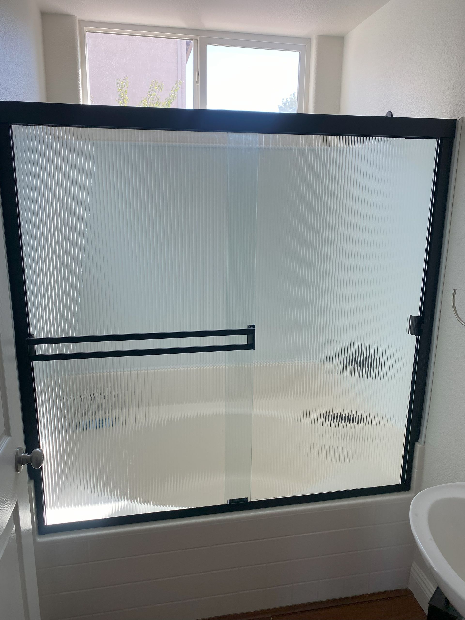 High-end bathroom remodel featuring frameless shower glass