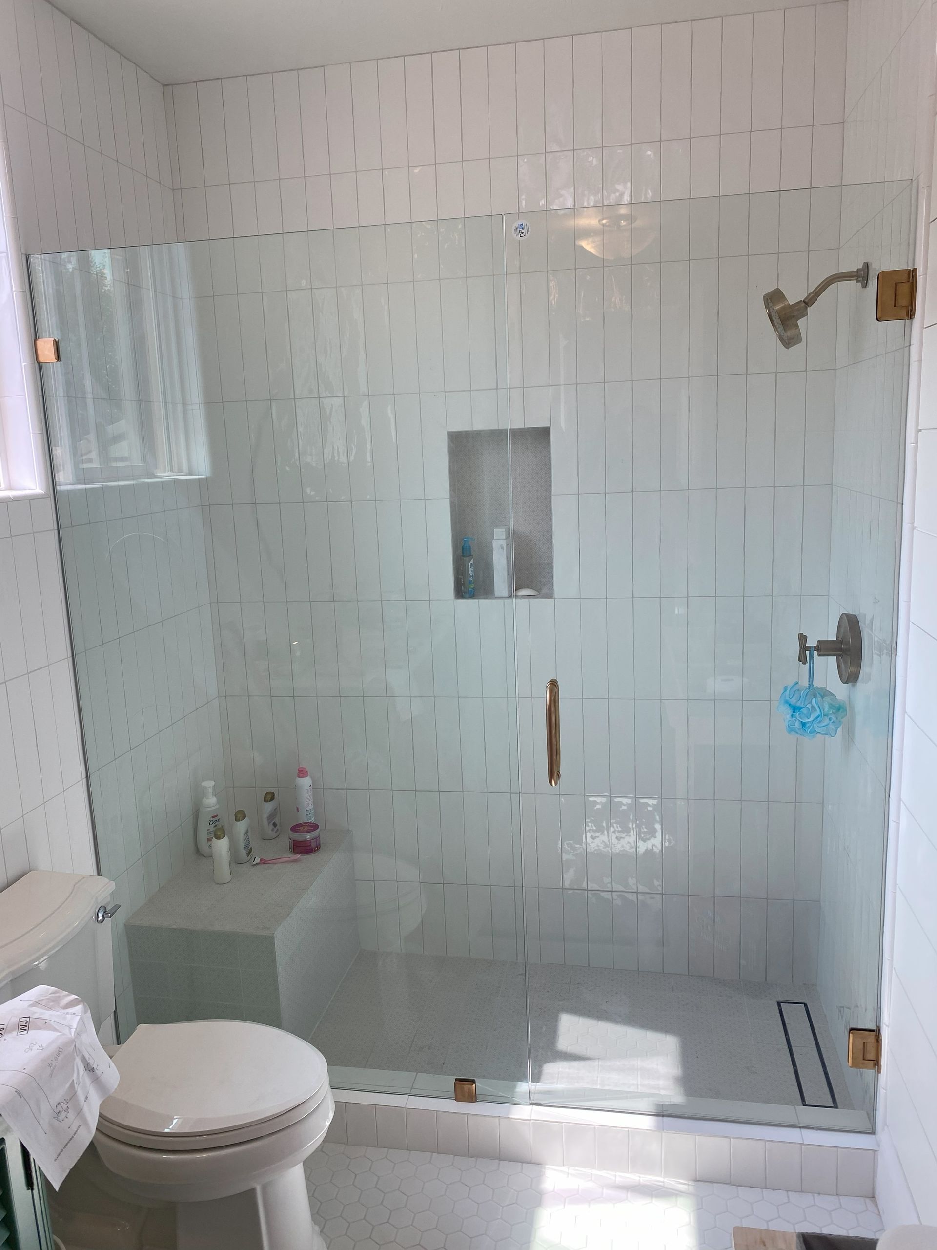 Clear tempered glass shower enclosure professionally installed