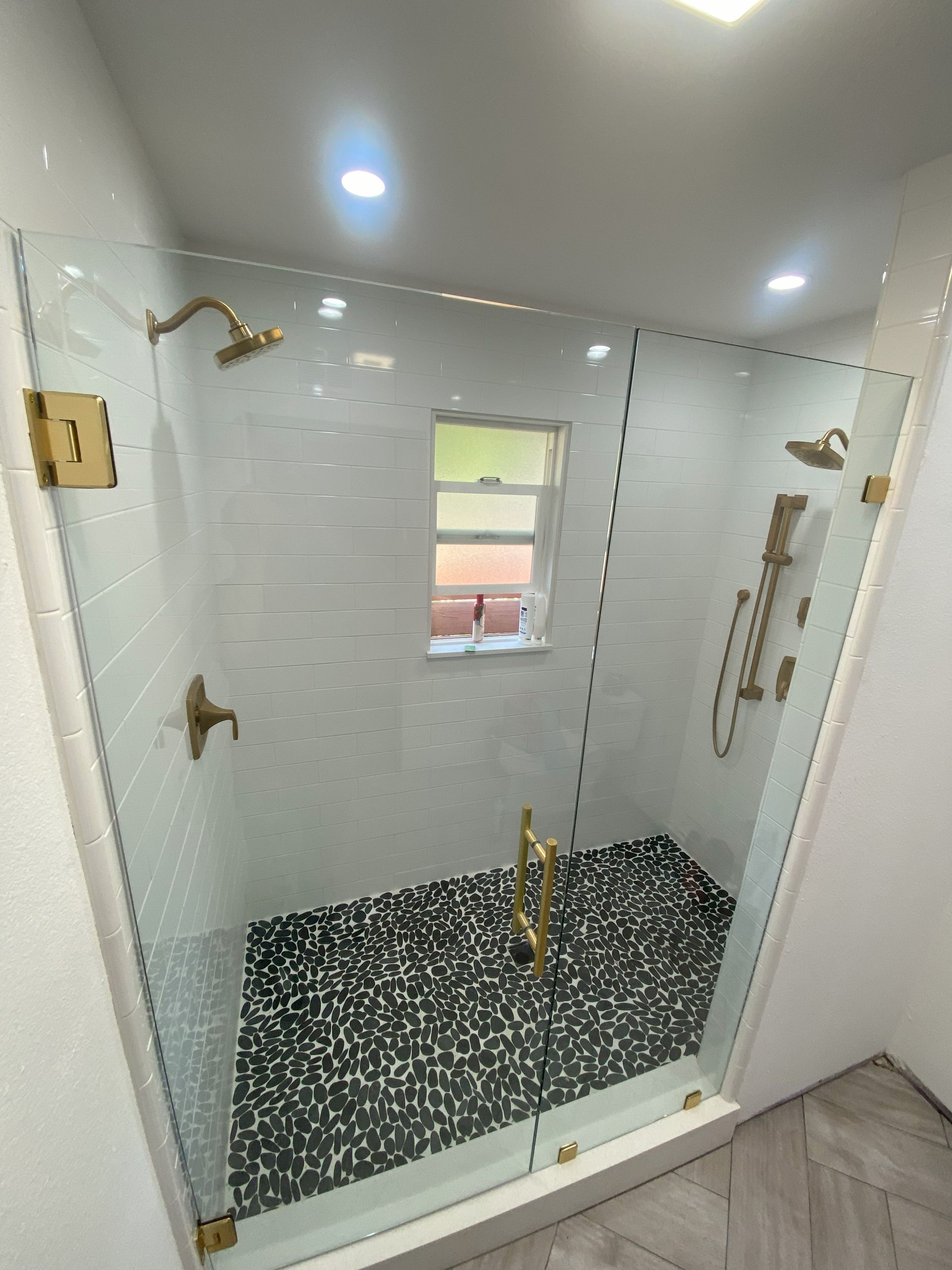 High-end bathroom remodel featuring frameless shower glass