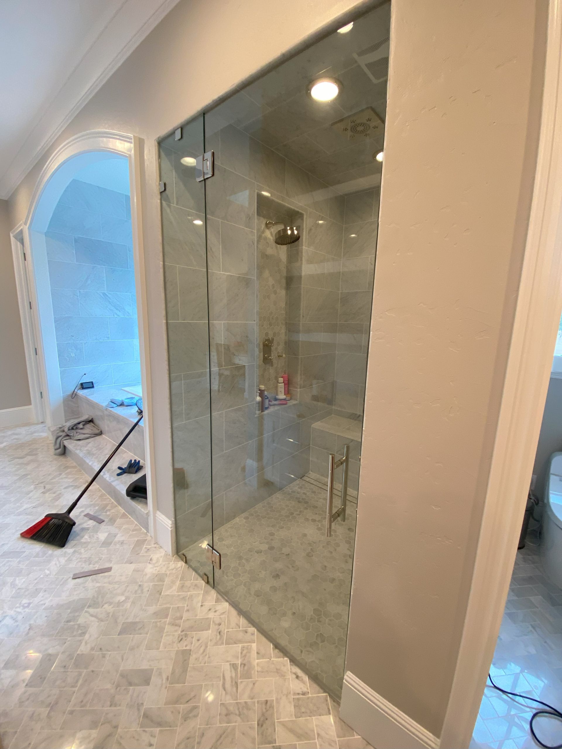 Custom frameless shower glass installation by Glassology in San Antonio TX