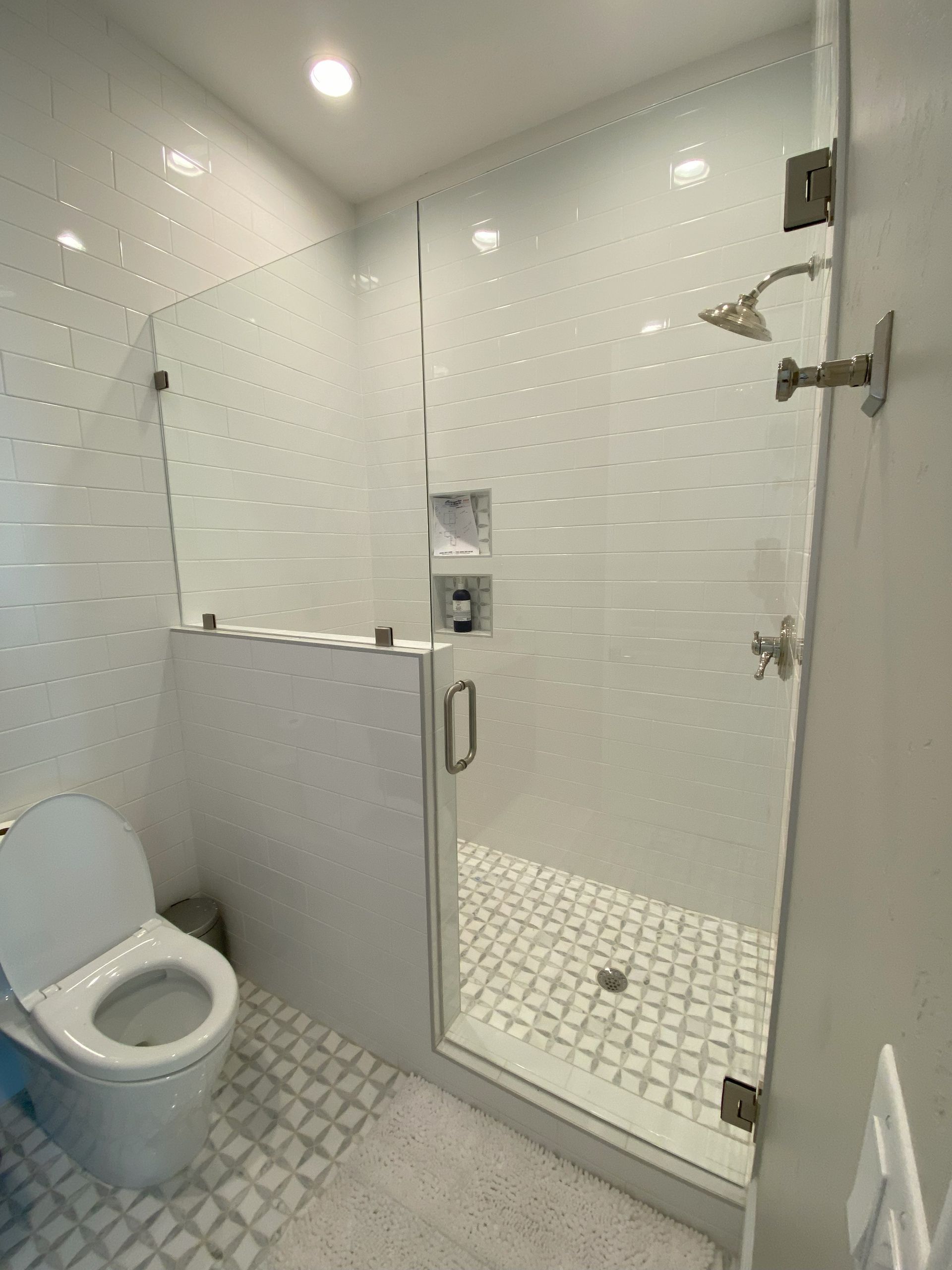Premium frameless glass enclosure by Glassology with clean seams and minimal fittings
