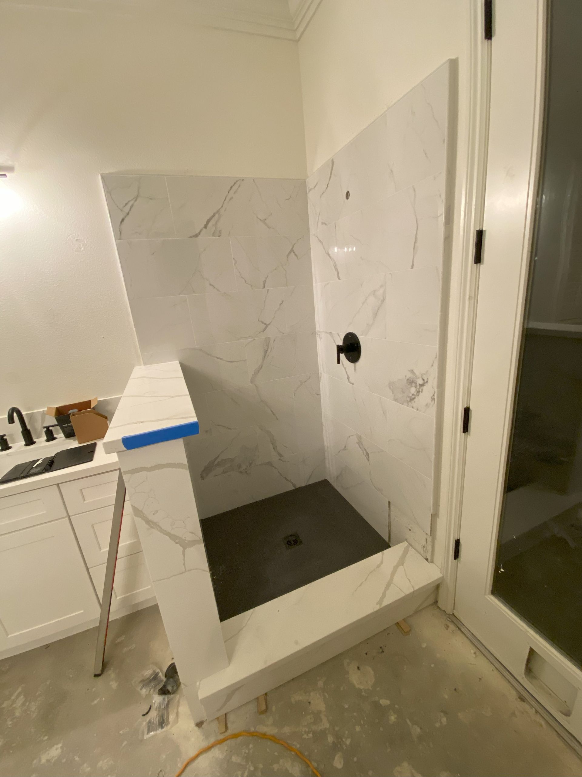 Frameless glass shower enclosure by Glassology featuring ultra-clear tempered glass and polished edges
