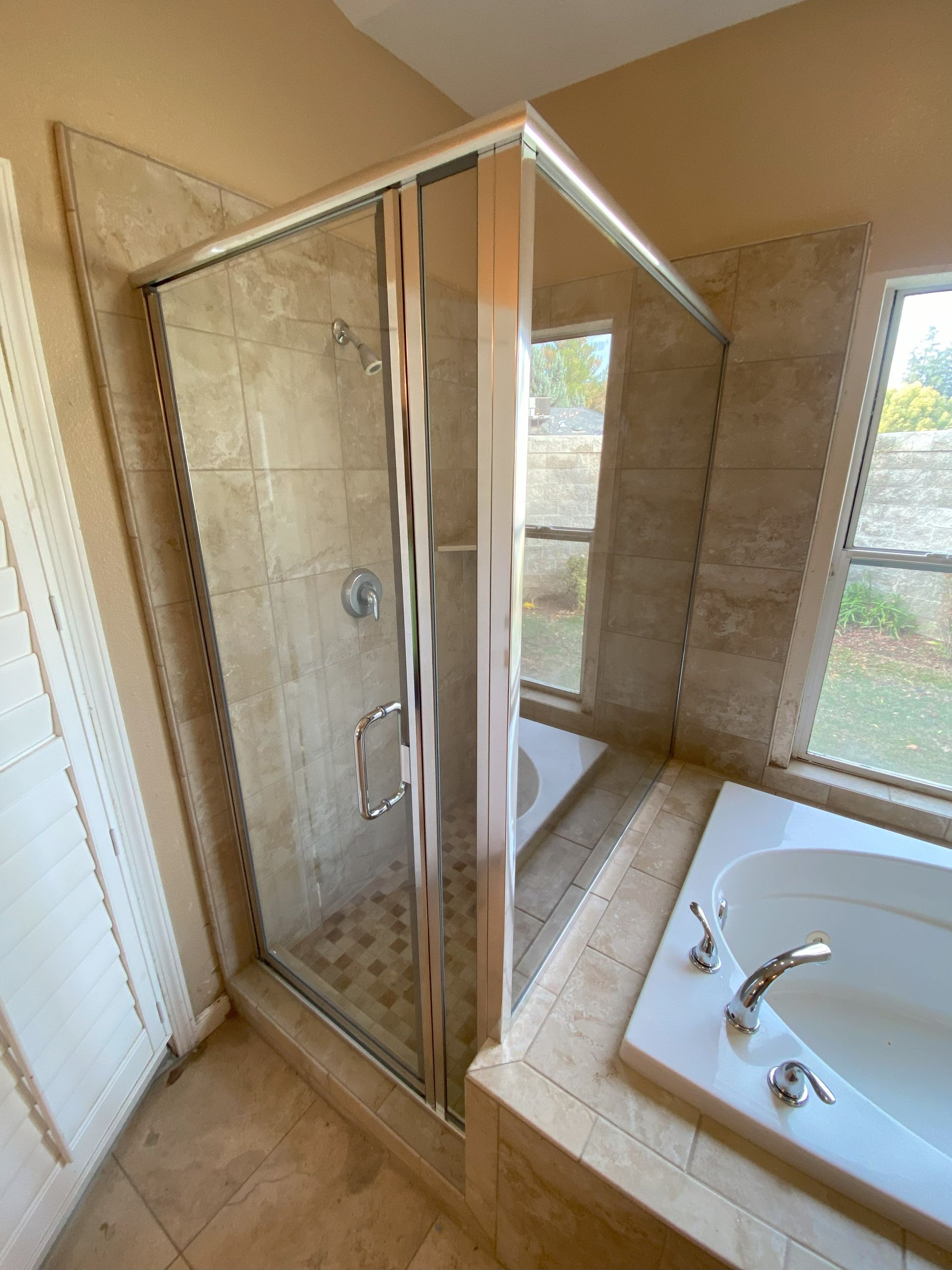 High-end bathroom remodel featuring frameless shower glass