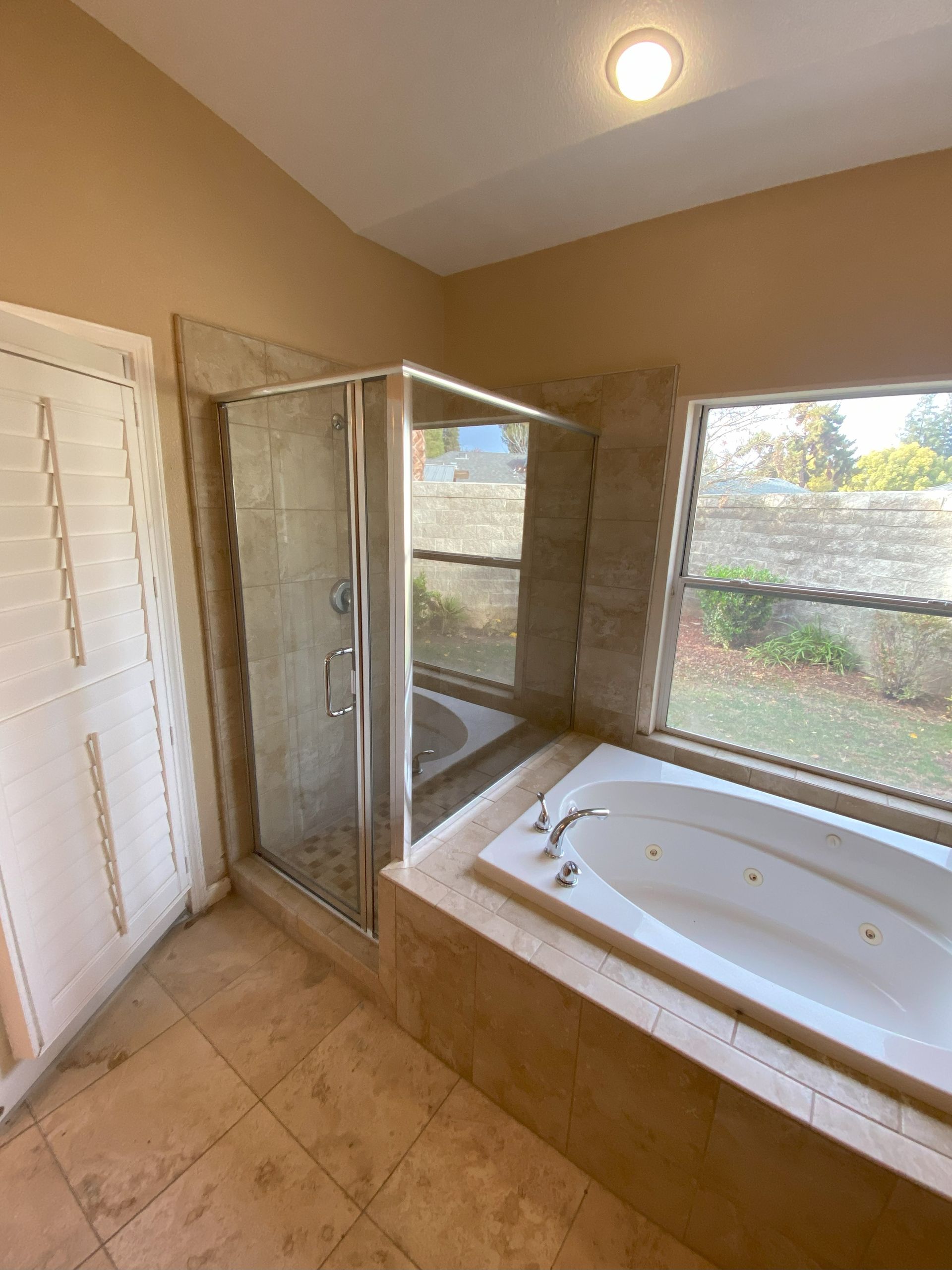 High-end bathroom remodel featuring frameless shower glass